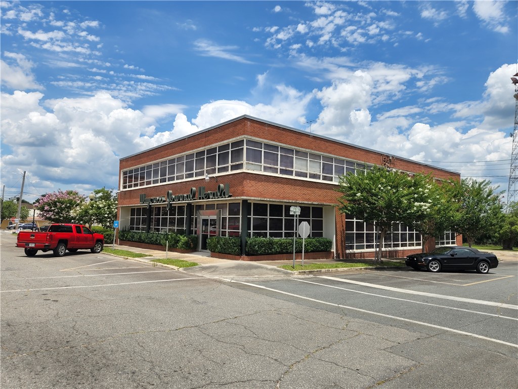 This terrific 12,632 SF commercial building with 1.14 acres (formerly the Waycross Journal Herald building) is located in the core downtown commercial business area of Waycross just one block from City Hall (Ware County, GA parcel ID numbers WA0901 015, 016, 017, 018, 019, 020 and 021). The property is located in the "Opportunity Zone".