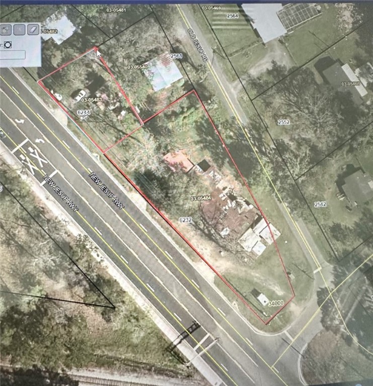 Two lots zoned HC totaling .72  acres located on heavy traffic area of Hwy 341. There is a 600 sq ft home that sits on the one parcel of .17 acres. This home is leased out through the month of June. Sold "as is"