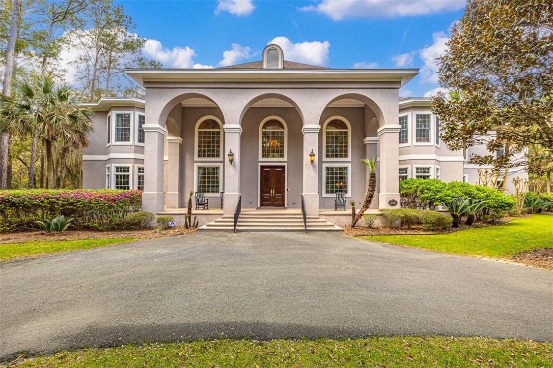 A stunning estate home on 9.4 acres on St. Simons Island provides a rare and unique opportunity for today's Buyer looking for privacy and convenience. This 6 bedroom, 6 bath, 2 half bath home consists of approximately 9,381 square feet and is located at the north end of St. Simons Island in the gated community of Butler Plantation. It is built with a modern design and timeless architectural detail. In this home you will find hardwood floors, 20+ foot ceilings and an abundance of windows to let in a lot of natural light. The living and dining rooms are ideal for entertaining and an eat-in-kitchen with a large center island and a butler’s pantry opens to a breakfast room and family room. The primary suite is on the main level with a sitting room, spa-like bath, walk-in-closet and a door leading to the home office. There are 3 additional bedrooms upstairs each with their own bath and there is an attached 2 bd, 2 bath guest house, perfect for a mother-in-law suite or live-in-nanny. This home also has a theater room with decorative stage lighting.  The garage holds 3+ cars, one of which is an RV garage. Outside you will find a gorgeous pool and spa and plenty of privacy. This fenced wooded home site allows for a barn and a max of 2 horses and so many options for the growing family that likes space both inside and out.  Make your appointment to view this property today.