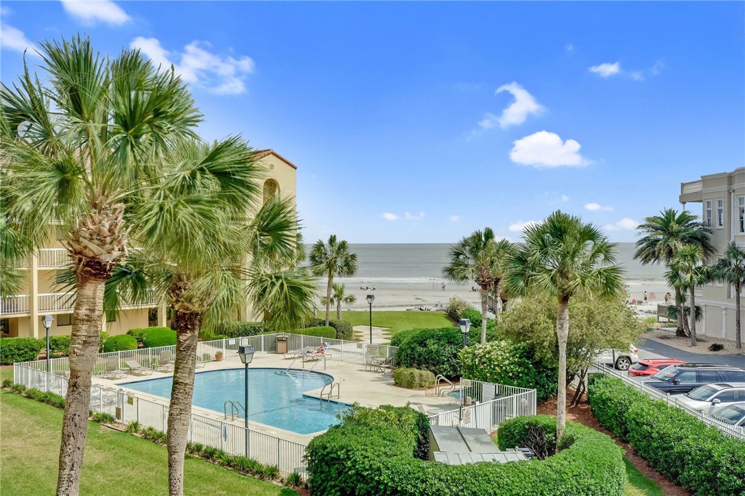 FABULOUS  OCEAN VIEWS in this 3rd floor, 2 bedroom, 2 bath condo in the King and Prince historic resort! Overlooking one of the three outdoor swimming pools and just a short walk to the beach. Dine at the on-site restaurant or walk one block to several of the best dining options on St Simons Island. Sliding glass doors off of the living room open up to a patio overlooking the pool and the beach. Wonderful opportunity to have an investment property on the beach or enjoy as a second home! Covered parking, an owner's storage closet for beach chairs. Gated access.