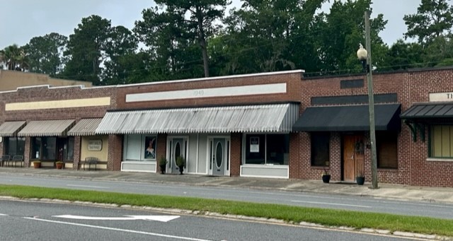 Downtown Woodbine, located on US HWY 17 (also known as Bedell Avenue) between City Hall and Post Office. One building demised into two units. Left side is leased, right side allows for tenant or owner occupancy. Great for general office use, medical or retail. Street parking and parking lot at rear entrance.