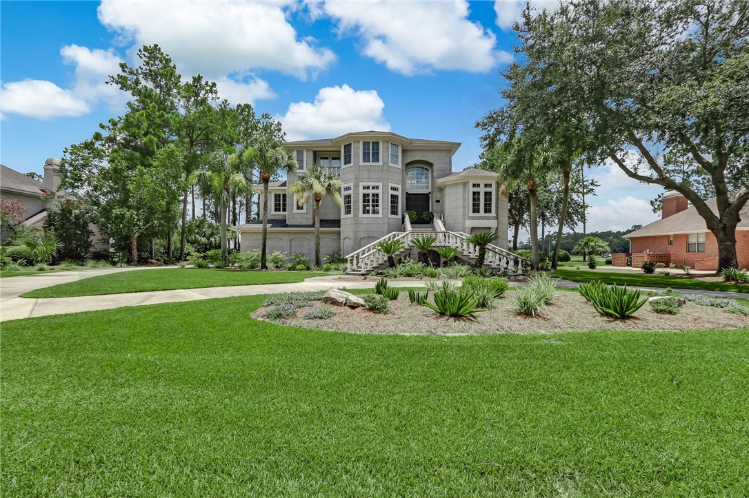 This stunning golf and marsh/river front residence built by Terry Stover Construction located in the gated, golf community of Osprey Cove offers beauty, breathtaking views and a fully renovated interior that will wow you!  Located in the prestigious gated community of Osprey Cove, this home boast unique details throughout and outdoor living spaces second to none.  This unique style home offers a thoughtfully sighted 3 story floor plan with an expanded living space great for relaxing in front of the fireplace or entertaining friends all while enjoying the fabulous golf and water front views from all 3 levels. From the moment you pull into the circular driveway, you are greeted by a grand staircase leading up to almost 3800 SF with 4 bedrooms, 3.5 baths and a newly renovated interior throughout. You'll enjoy the abundance of natural light, exquisite details throughout and a custom chef's kitchen boasting beautiful cabinetry, granite countertops and stainless appliances.  Also located on this level is a nice sized dining room, a half bath, a large laundry room with custom cabinetry, two additional bedrooms and a full bathroom.  There are exquisite details throughout with crown molding, a fireplace with built-ins and beautifully redone hardwood floors. This house offers multiple levels providing bedrooms and bathrooms on each level, including a primary retreat on the top level that provides breathtaking views of the river, marsh and golf course, a private study and porches on the front and back of the home. The primary bathroom has a soaking tub, a separate walk-in shower and double vanities with amble storage in the custom cabinets. The lower level is the perfect space for privacy as it offers a bonus room with plumbing in place should someone want to add a full kitchen, a large bedroom with an additional full bath and plenty of storage. Also located on the bottom floor is a nice sized 3 car garage.   As you step outside, you have the option of a covered patio or a screened in porch with once again, sweeping views of the golf course and marsh.  The large array of windows offers lots of natural light and views of this truly stunning property that you will be proud to call home. This magnificent home offers the true elegant style of Osprey Cove living and makes available application for membership rights to join Osprey Cove.  Osprey Cove is a gated golf community with amenities including Har-Tru Tennis Courts, Fitness Center, Hiking Trail, Junior Olympic size pool, boat dock and more. Located conveniently to Jacksonville, FL, one is only minutes from world class health care at Mayo Clinic and a 30-minute drive to Jacksonville International Airport. Also, you are only 30 minutes away from the beaches at Fernandina Beach and Amelia Island. Come visit today and see the "Best Kept Secret" on the coast of Georgia.