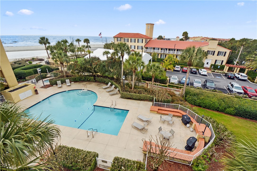 GORGEOUS OCEAN VIEWS in this 4th floor 2 bedroom, 2 bath condo in the King and Prince historic resort! Overlooking one of the three outdoor swimming pools and just a short walk to the beach. Dine at the on-site restaurant or walk one block to several of the best dining options on St Simons Island. Sliding glass off of living room opens up to a patio overlooking the pool and the beach. Wonderful opportunity to have an investment property on the beach or enjoy as a second home! Covered parking, an owner’s storage closet for beach chairs, and gated access.