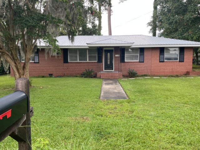 This lovely mid-century brick ranch has been beautifully updated, yet it still includes the original sanded on site hardwood floors.  The owners have updated the kitchen with stainless appliances, updated and tiled the baths, added new HVAC, water heater, roof, and rewired the home, just to name a few things.