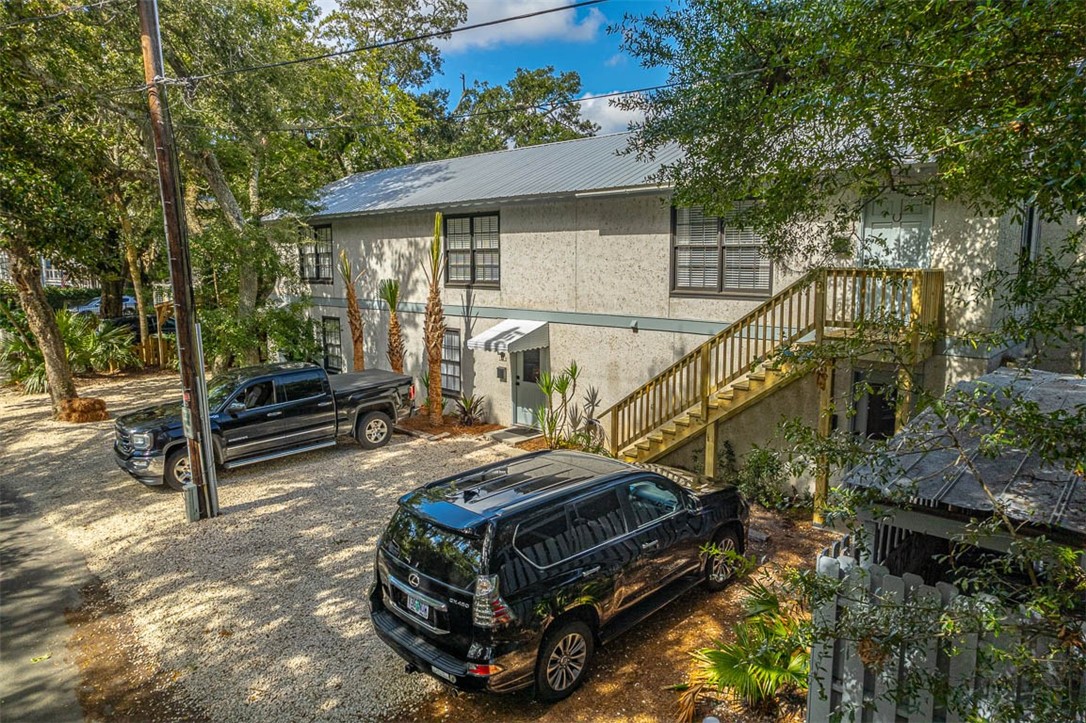 Rare opportunity to own property on St. Simons Island with STELLAR LOCATION!  Property consists of 3,450 SQFT with 4 separate units: 3 condos (1221, 1223, & 1225 Forest Street) and 1 efficiency (1227 Forest Street).  Possibilities are endless here:  Use one of the units as your island getaway and rent out the other 3 to offset expenses.  Condominiumized the building and sell off each unit.  Or have a place for your whole family to visit where everyone has their own privacy.  Seller has done an amazing job renovating these units into modern condo/townhomes offering fenced in patio areas.  Shopping & restaurants are within a very short distance.  Crabdaddy’s, Crab Trap, Barrier Island Brewery, & Beachcomber BBQ are located on the same block and 1 block away is the King & Prince Beach Resort w/ Echo restaurant as well as Fiddlers.  Two of the units have long term renters in place.  Showing appointments are necessary.