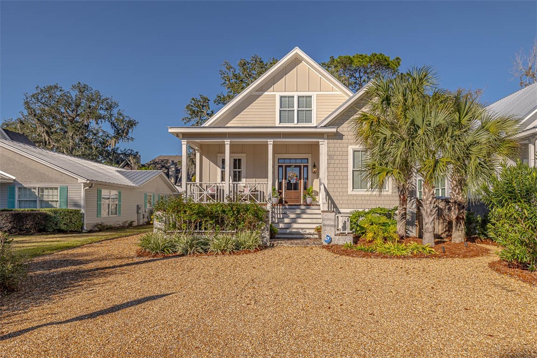 Enjoy life on St. Simons in this custom home that has been beautifully designed w/top of the line finishings and NO SHORT-TERM RENTAL RESTRICTIONS and NO HOA!!! This home is being sold FULLY FURNISHED! Entering, you will find 80+ year old brick from the Levi denim factory & tabby/hardy accents along the exterior & a beautiful landscape courtyard and front porch. For the interior, the main level features two bedrooms, one including the master suite w/ upgraded lighting, floating tub, dual vanities, WI shower & closet, and quartz/tile finishing & a guest en suite. The living space features a gas log fireplace open to a dream kitchen with a quartz island & counters, custom cabinetry, & stainless-steel THOR gas range. Throughout the home, the owner used finest materials: European natural oak hurst flooring, shiplap, tile floors, upgraded lighting package, & custom doors. Second floor has two guest suites with jack & jill bath, even space for an office! Huge screened in back porch overlooking the backyard where there’s plenty of room for a pool!