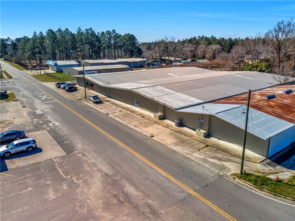 Amazing opportunity to own this 43,037 sqft building located on the well-trafficked HWY 341 in Odum. This 2.4 acre lot offers 3 metal buildings. One being 8,145 sqft, another 13,024 sqft, and the main building being 43,037 sqft. The main buildings offers 4 office spaces, a kitchen and 2 restrooms. Inventory does not convey. Listing agent is related to one of the sellers.