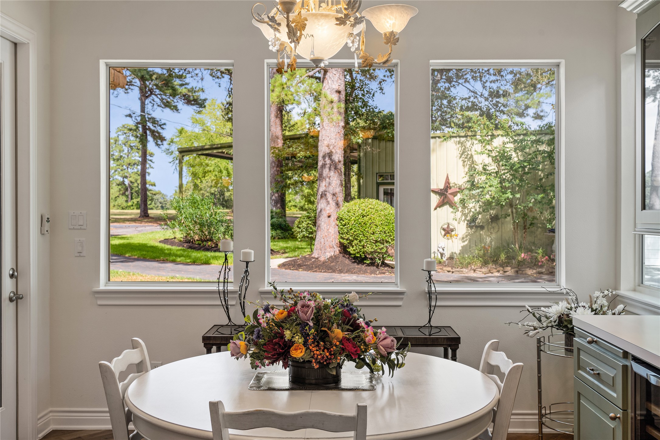 The dining room also overlooks the backyard and features a beverage station with a wine refrigerator.