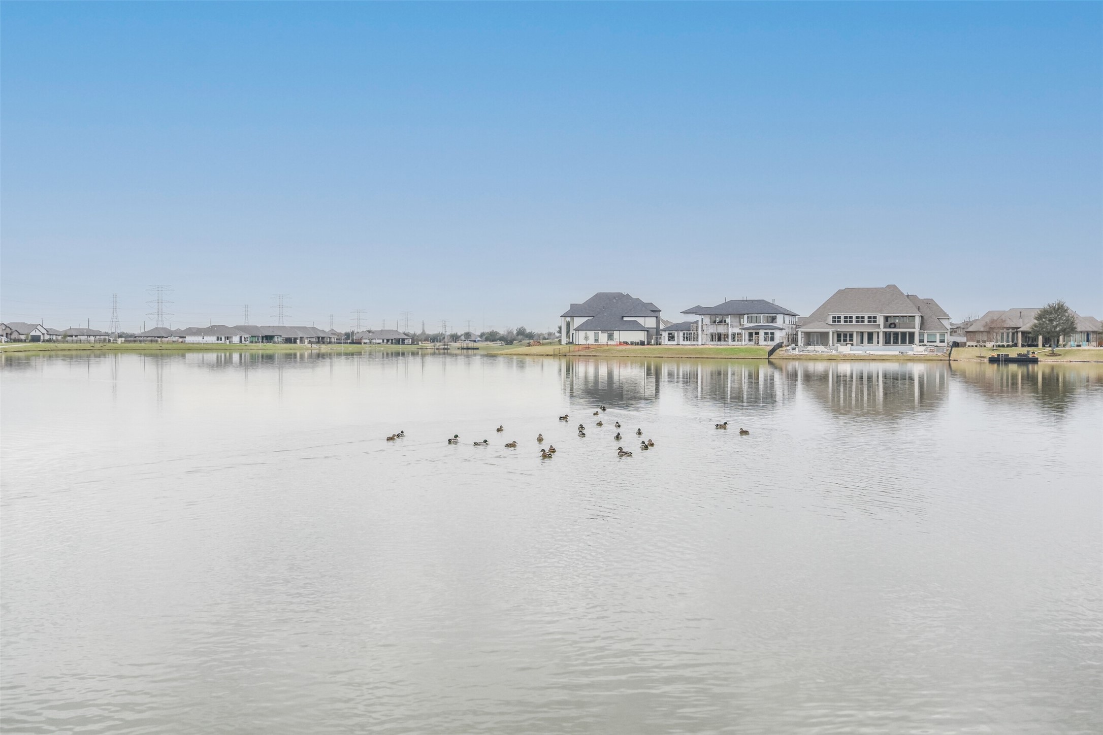 Location is unbeatable in this walkable community with lake access and private gated entrance.