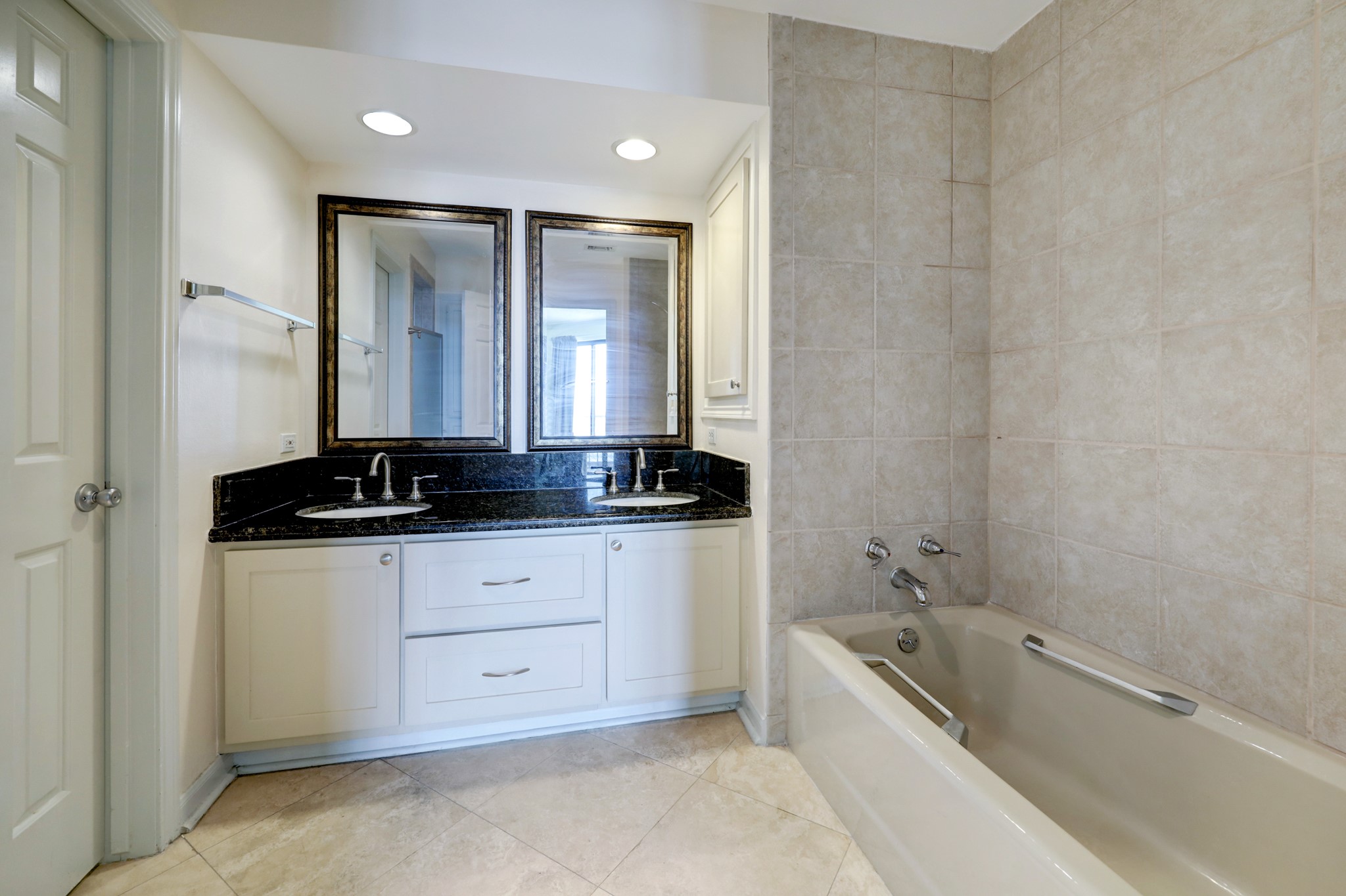 The ensuite primary bath features two sinks, separate shower and tub, and a separate water closet room. Plenty of cabinet space plus a separate linen closet.