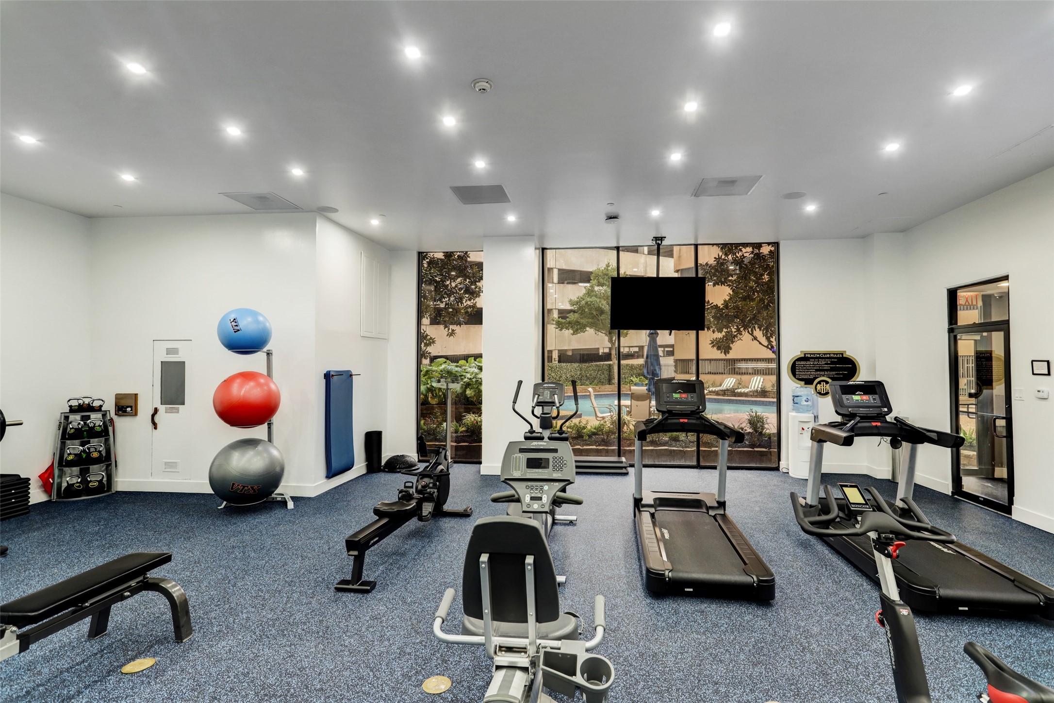 The fitness center includes a dry sauna and overlooks the pool area. It has recently been remodeled and new equipment as of July, 2021.