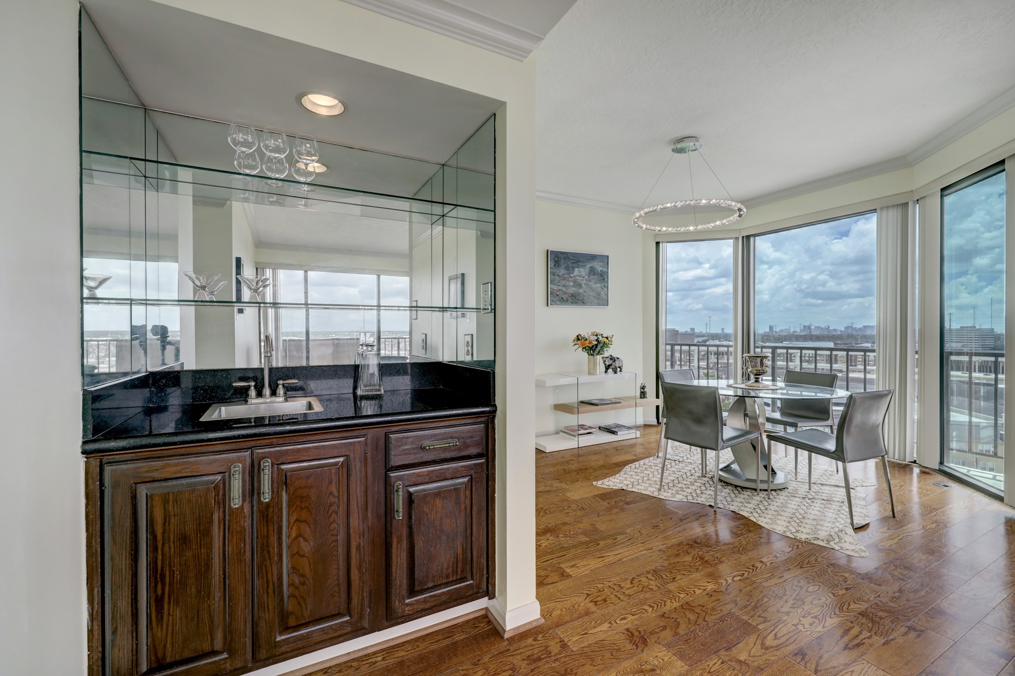 The wet bar is conveniently located between the living room and dining room and provides entertaining ease.