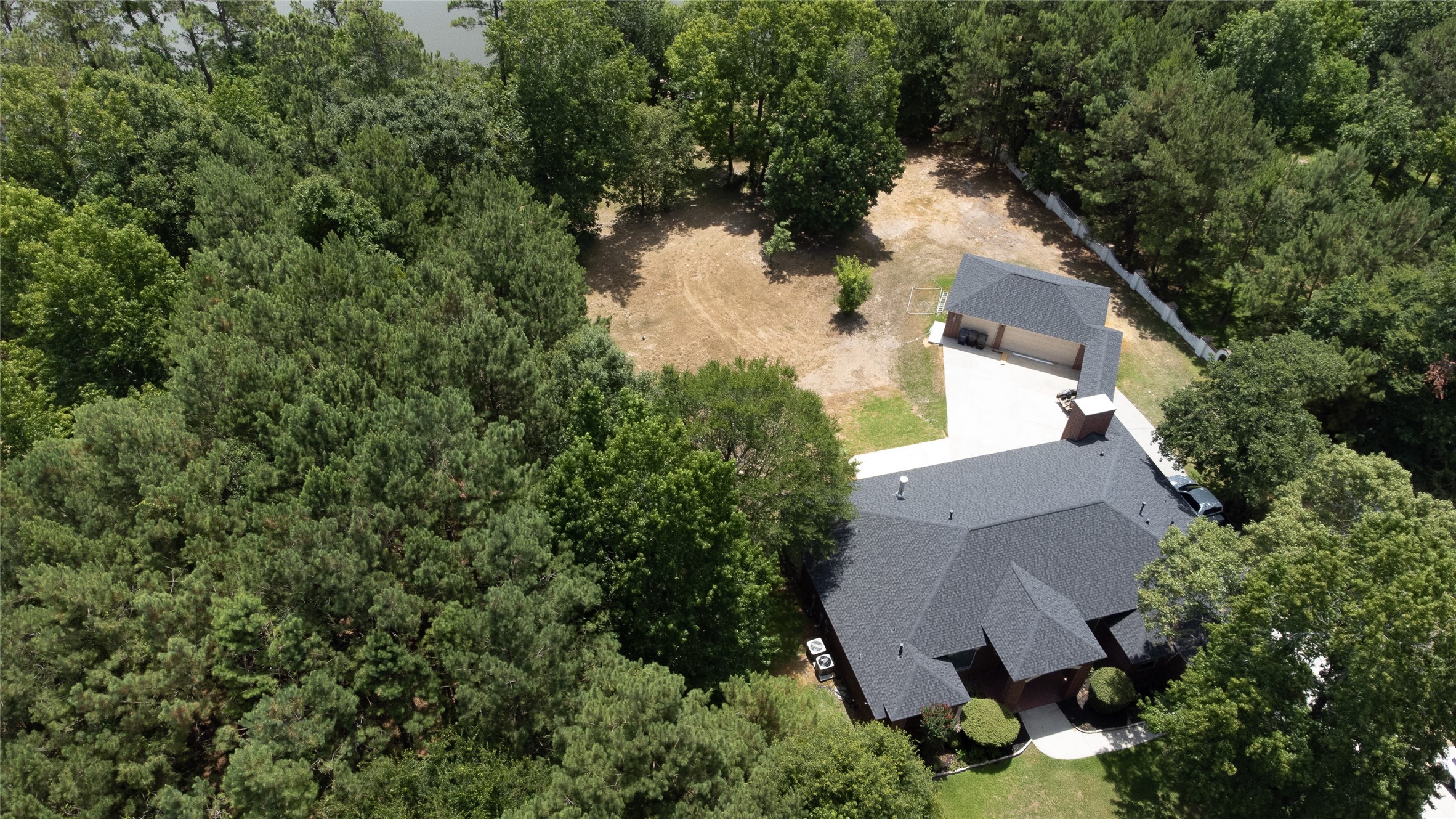 Aerial view of the property to the pond