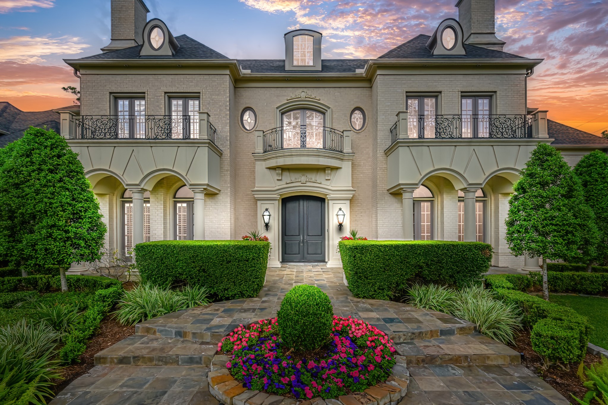 Stately facade, elegant and gracious formal landscaping ideally situated on over 36,000 square feet in coveted Hunters Creek Village.