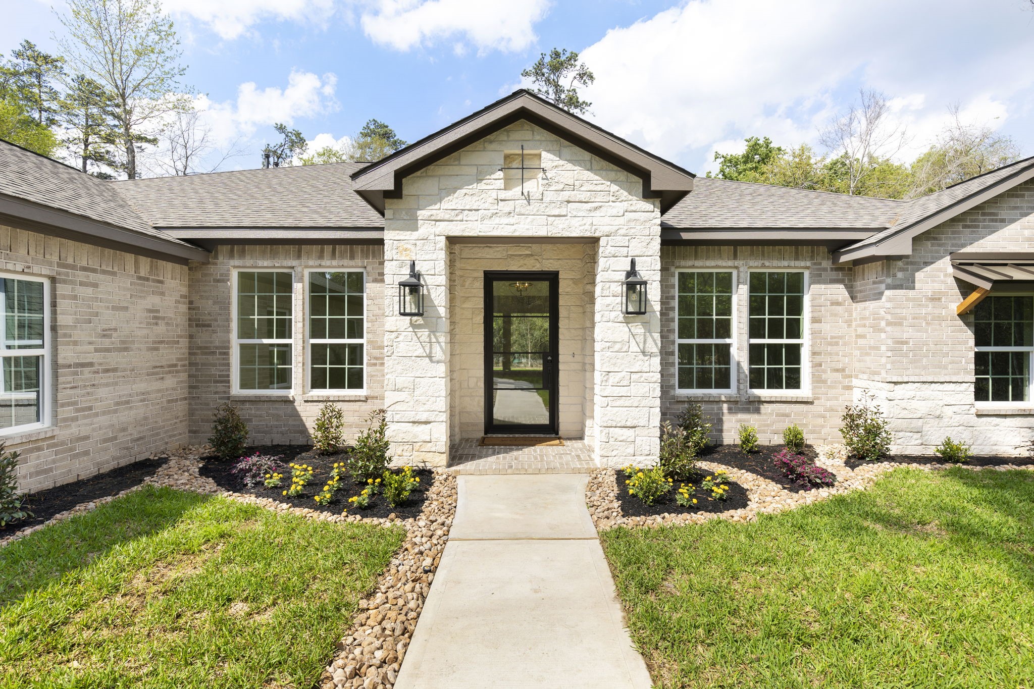 Gorgeous curb appeal with limestone elevation accents.