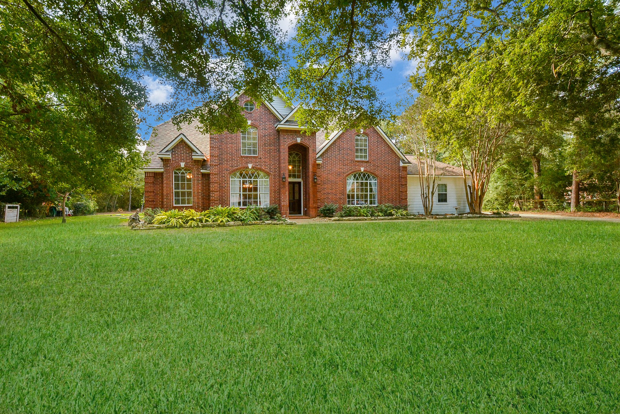 Welcome home to this beautiful estate home situated on a 1.15 acre wooded lot on a cul-de-sac.