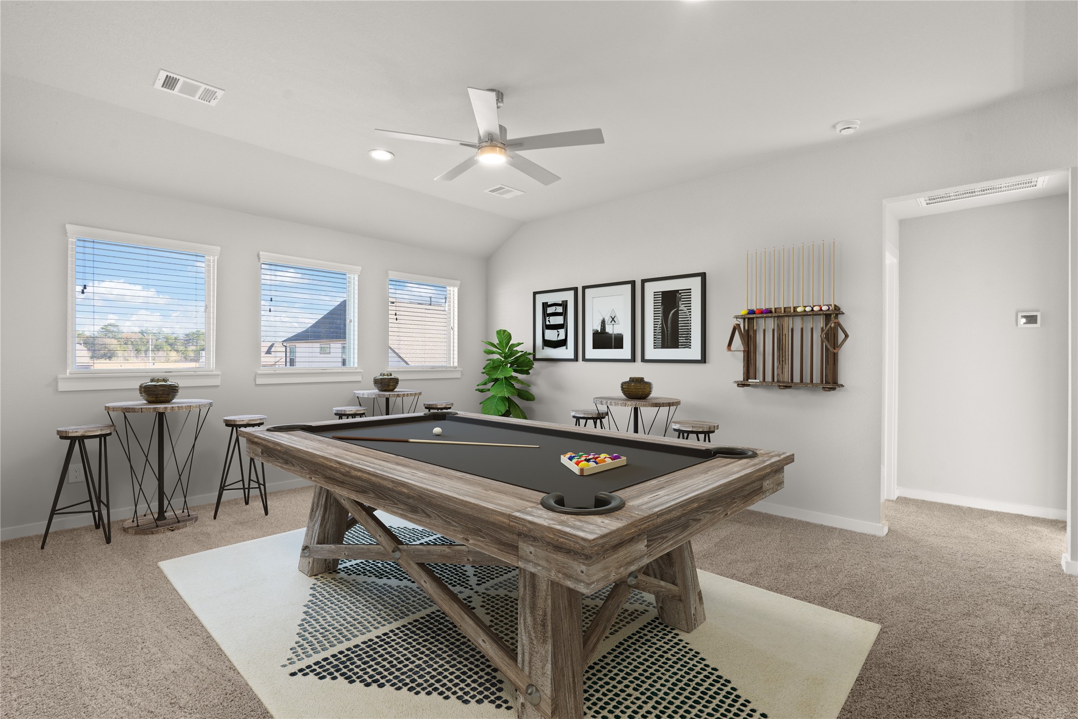 Come upstairs and enjoy a day of leisure in this fabulous game room! This is the perfect hangout spot or adult game room, this space features plush carpet, high ceiling, recessed lighting, custom paint and large windows with privacy blinds.