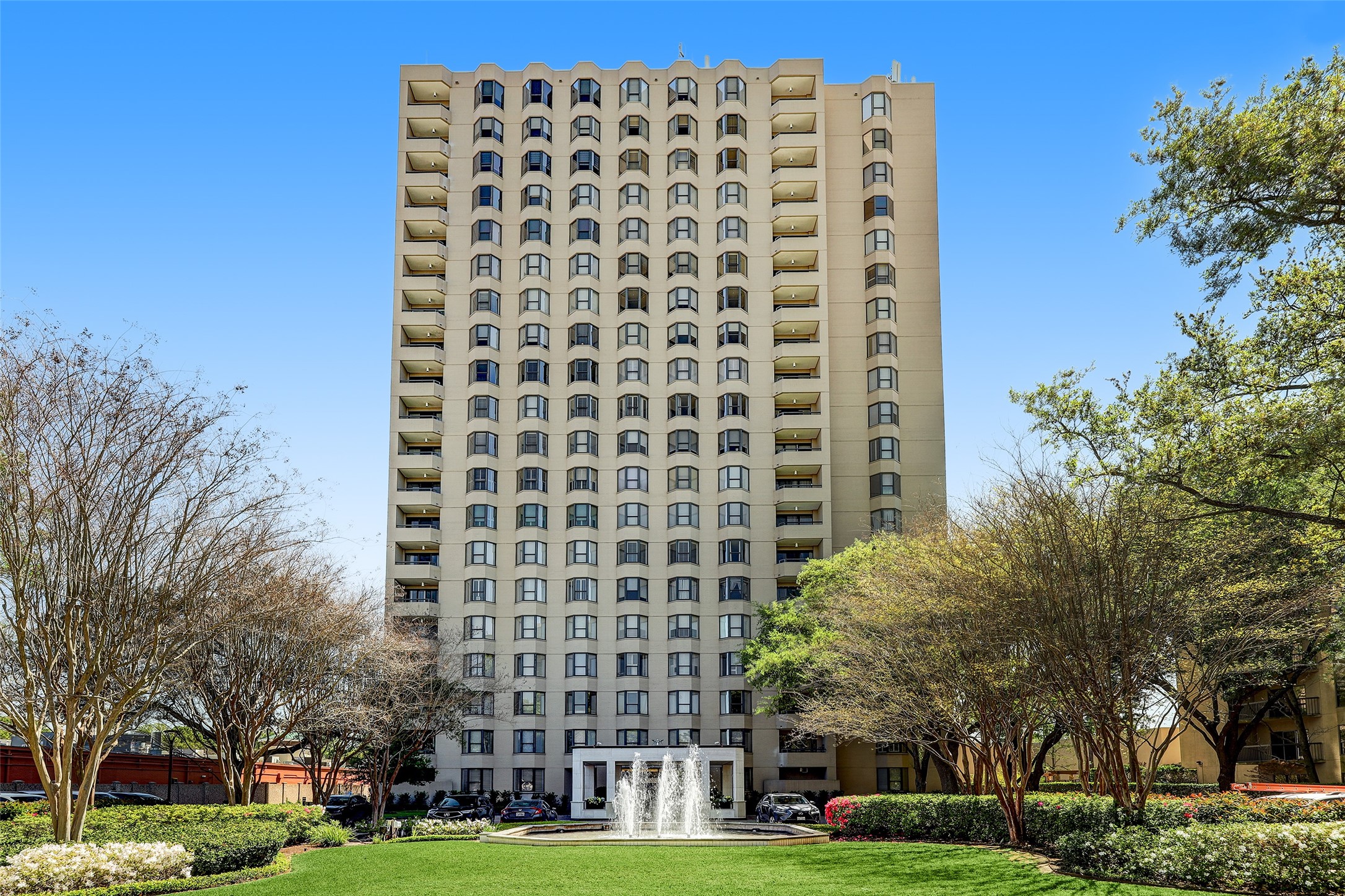 High-Rise with Fountain and Guest Parking in Front.