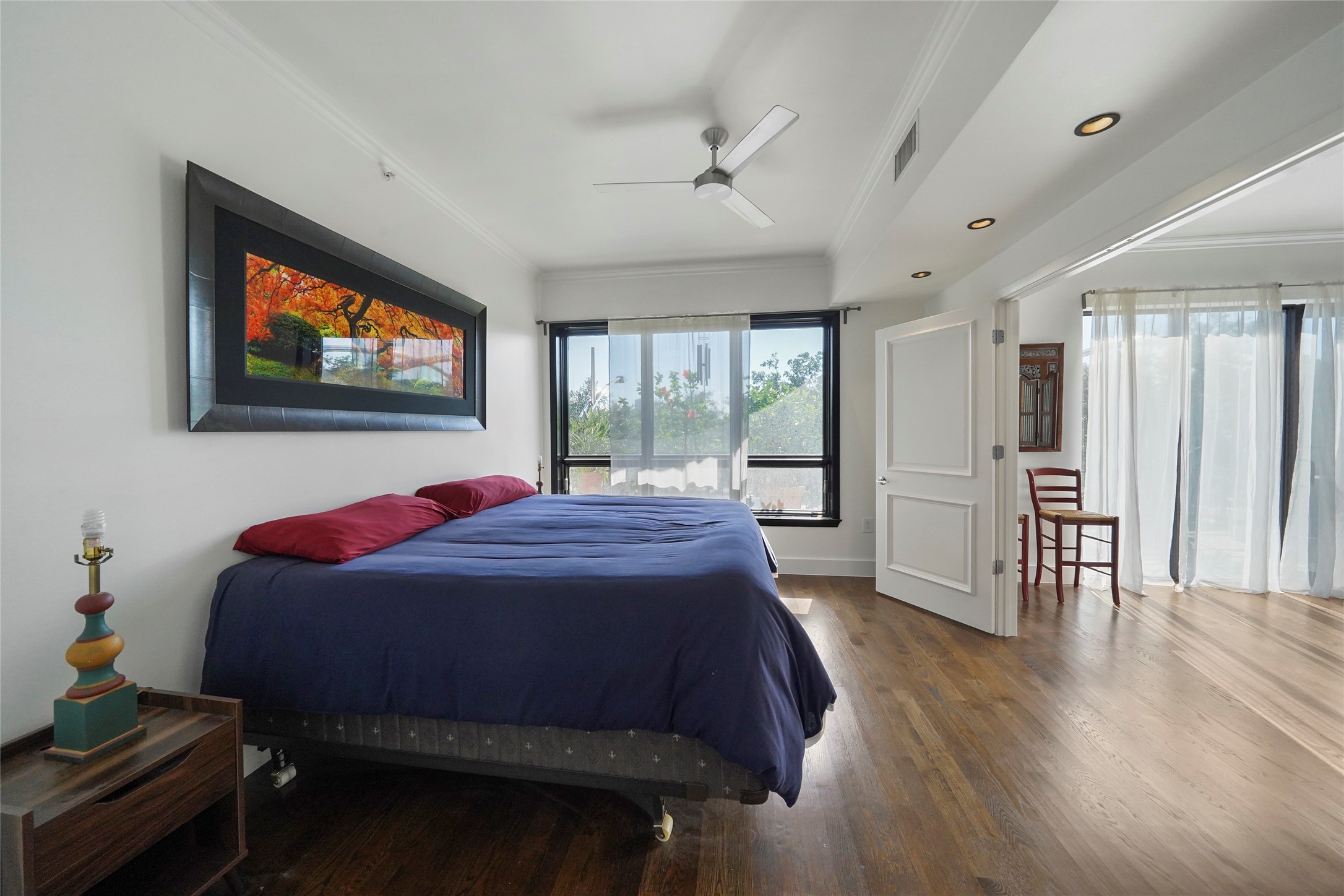 Huge windows in the master bedroom allow ample natural lighting.