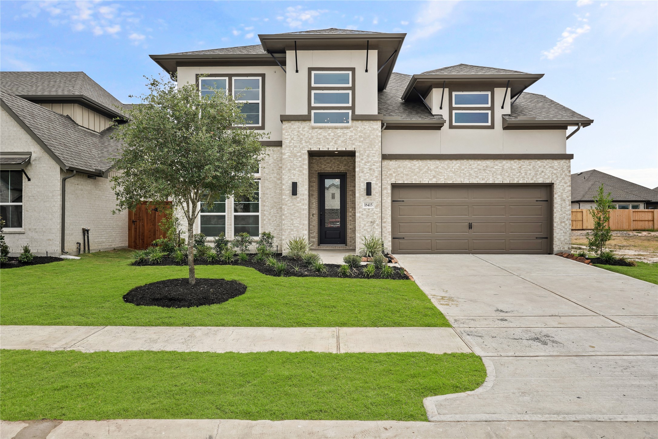 Exceptional modern elevation with brick & stucco offers lots of curb appeal!