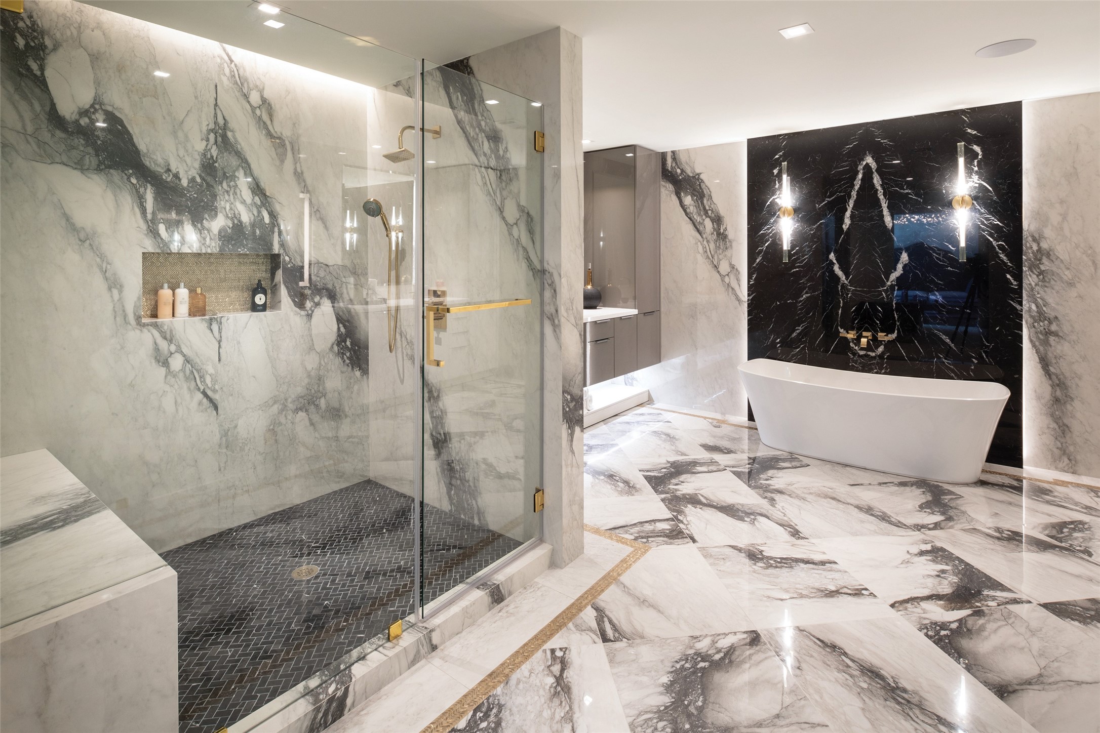 Luxurious bathrooms appointed in gold fixtures, a vast selection of stones, porcelains, and/or all to your design specification.