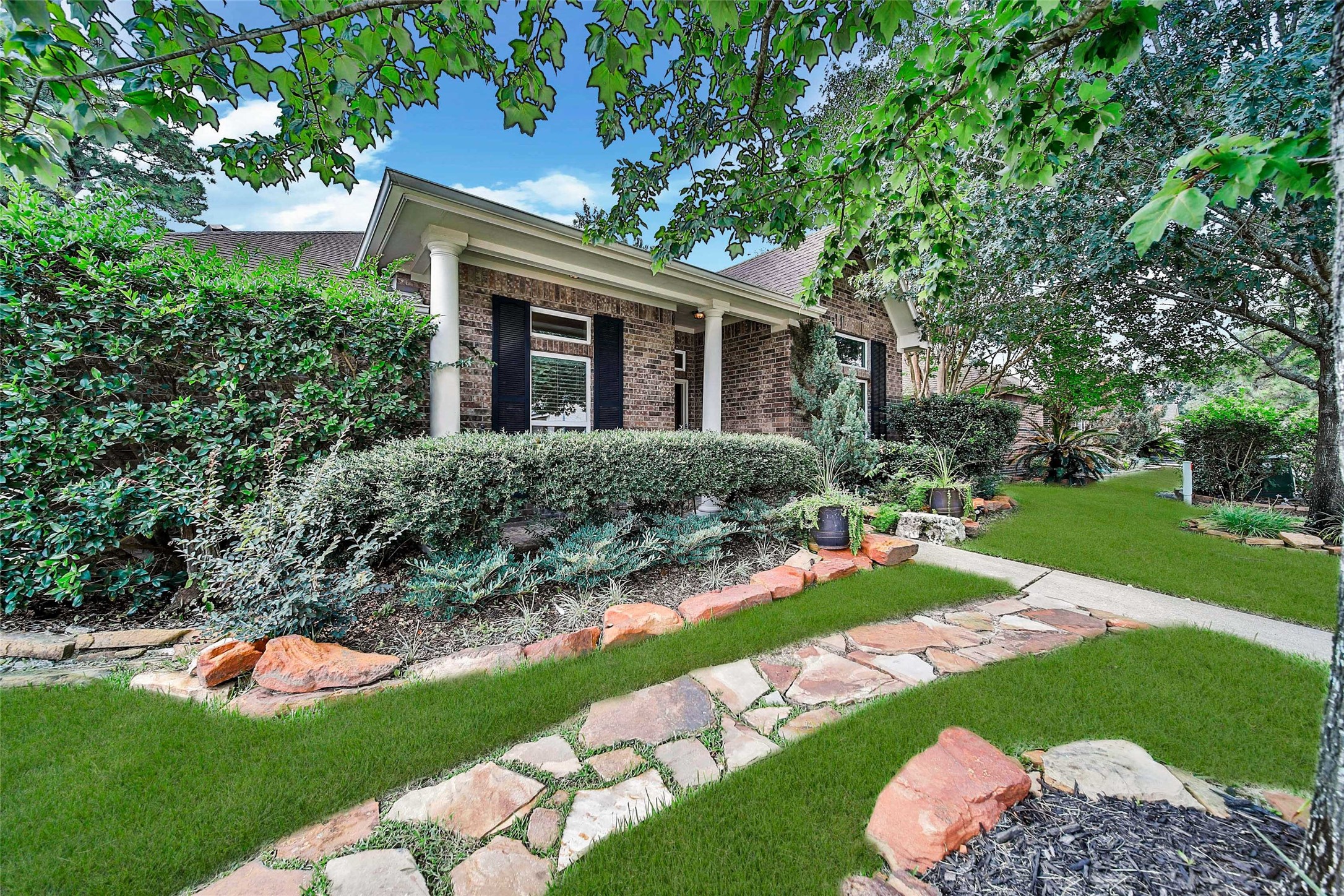 Superb curb appeal with cozy covered patio