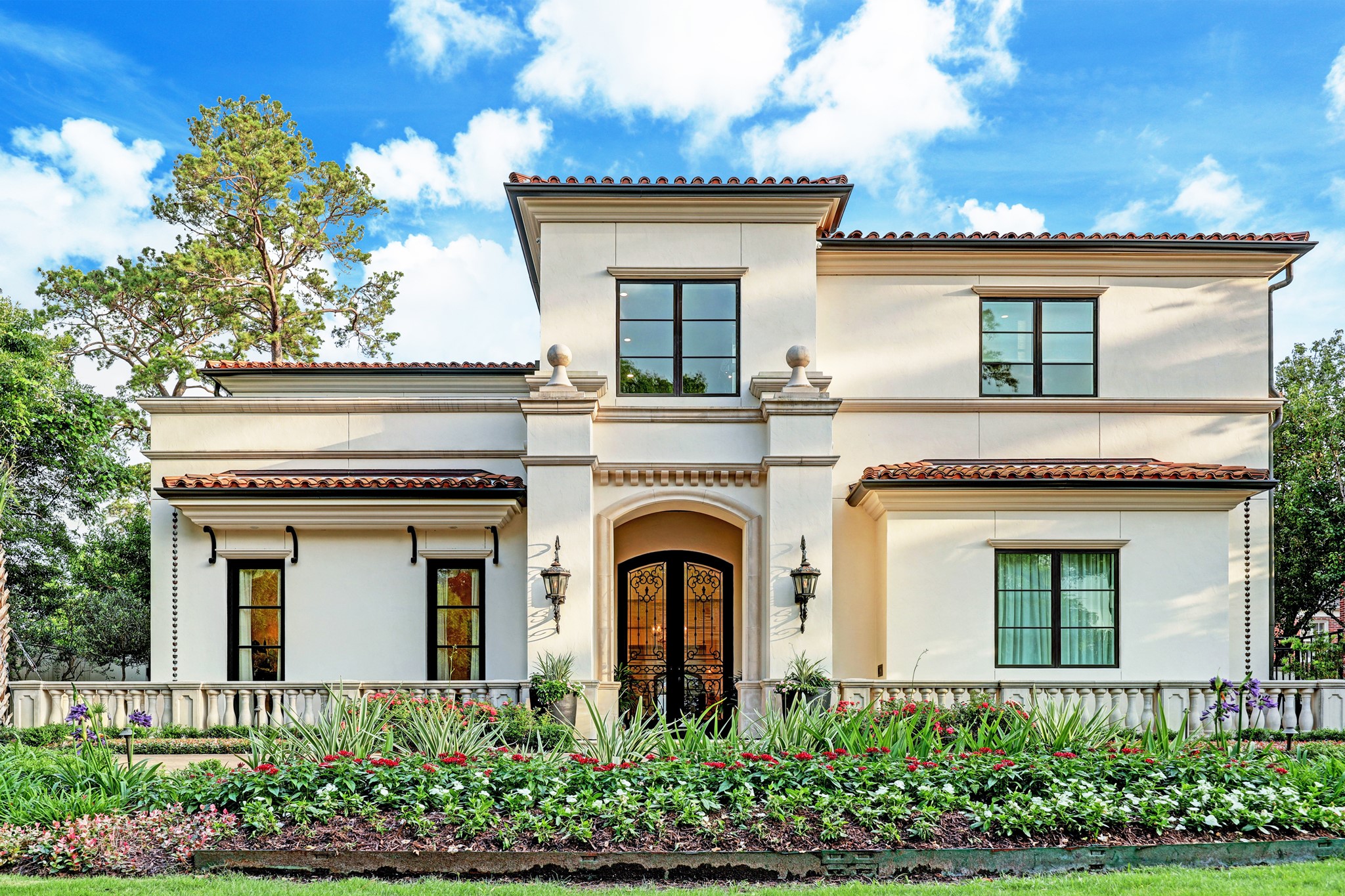 [Front Elevation]
Exterior appointments include handmade, number 5-rated Mexican terra cotta roof tiles; True Stucco exterior cladding; wrought iron window accents and balconets; and designer gas lanterns