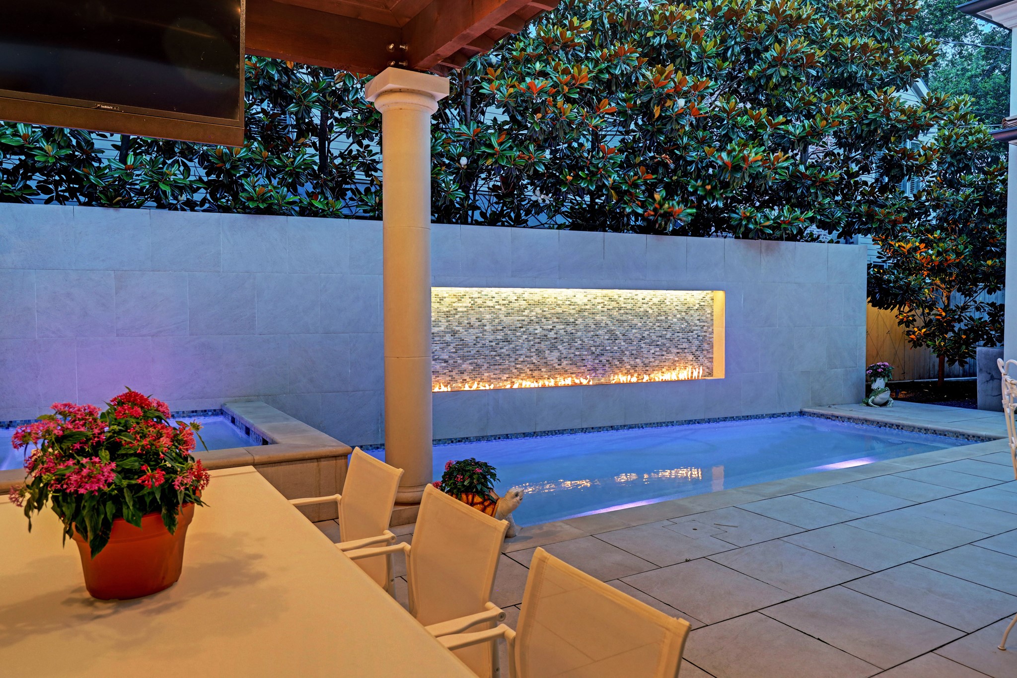 [Spa and Pool] Note illuminated decorative tile fire wall above the pool.