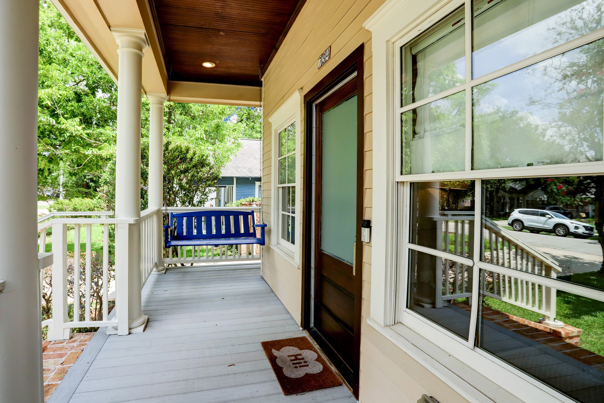 Front porch with porch swing.