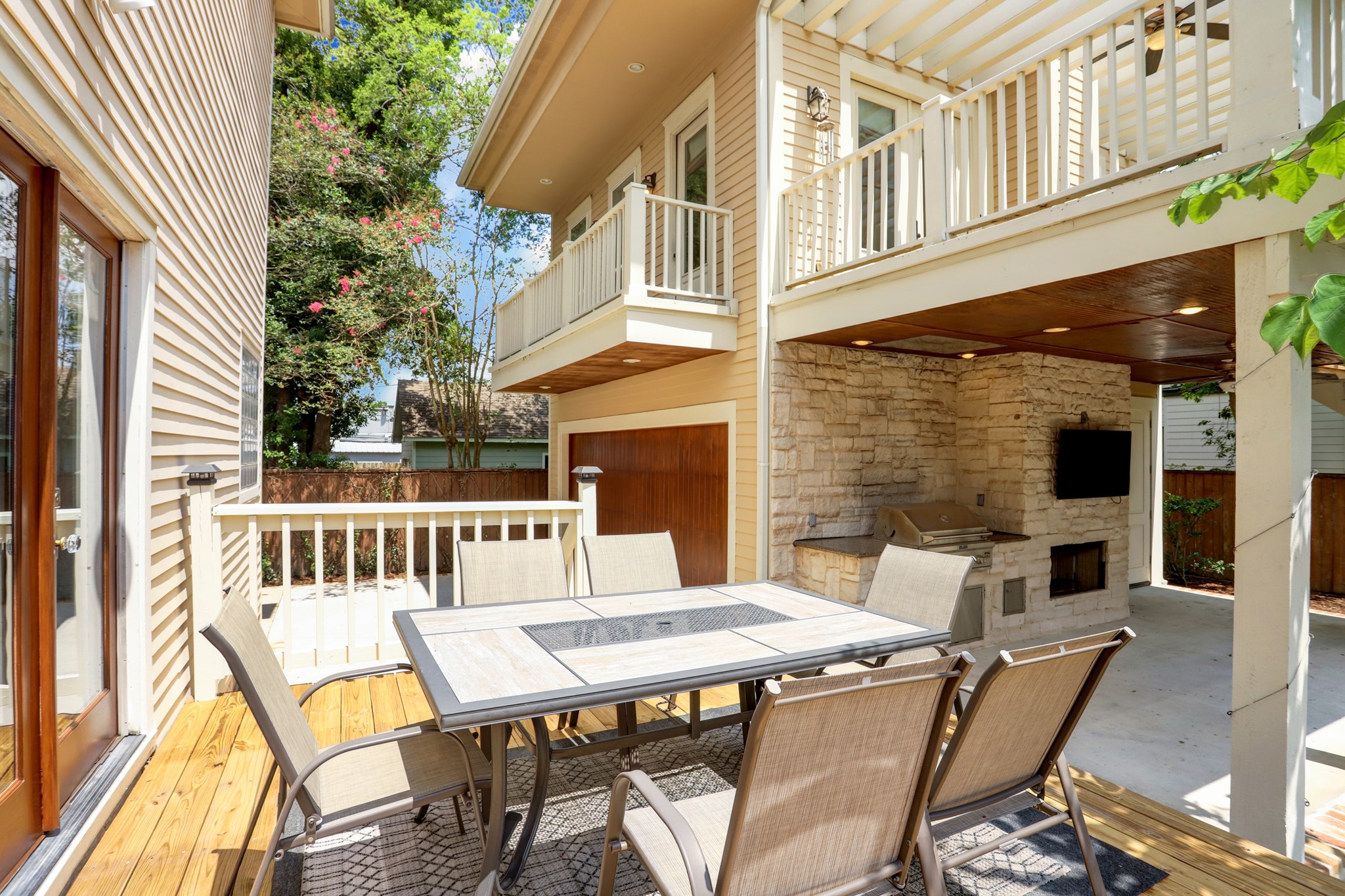 Outdoor deck offers an area uncovered for dining or relaxing.