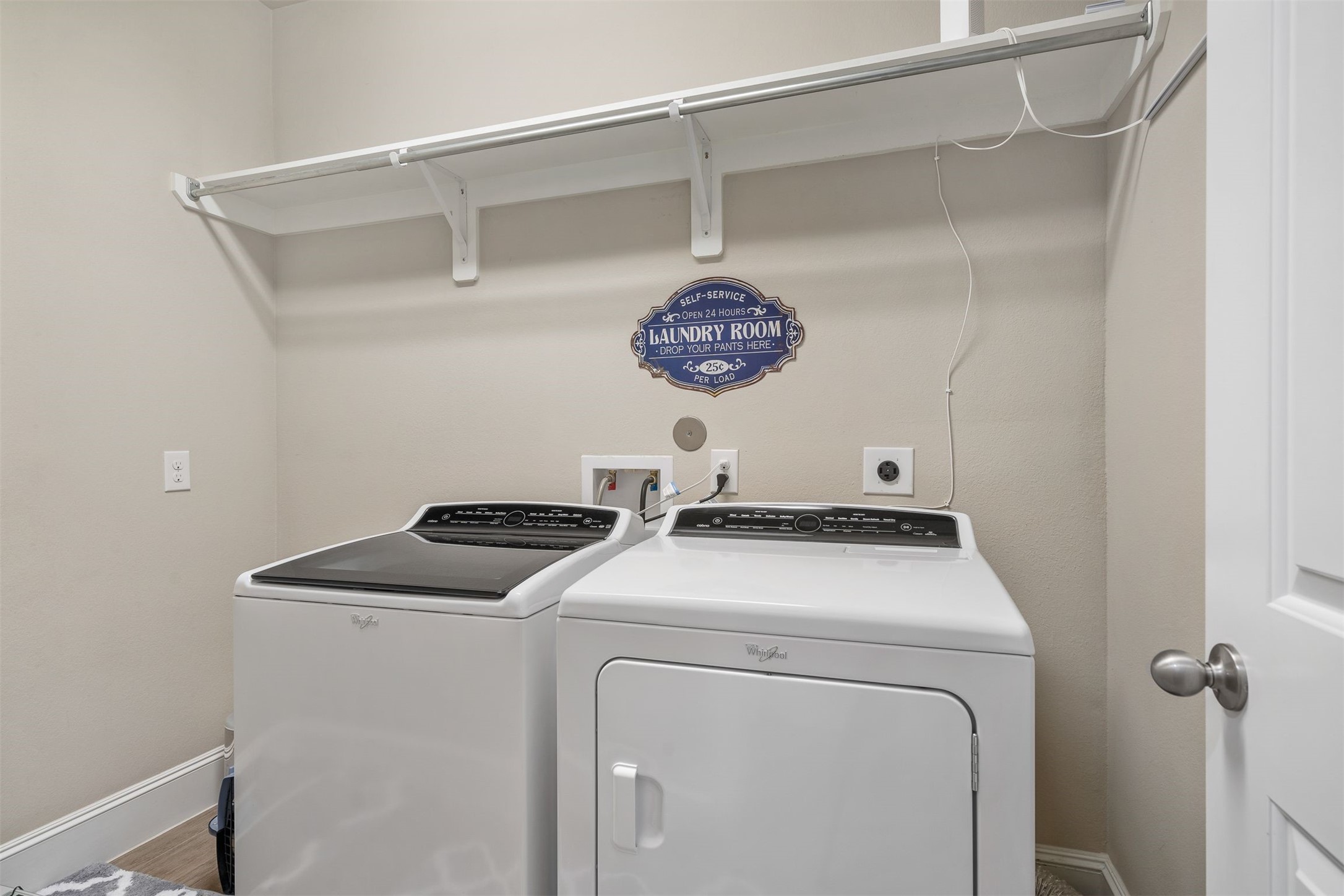 Utility room with hanging rods for drying clothes!