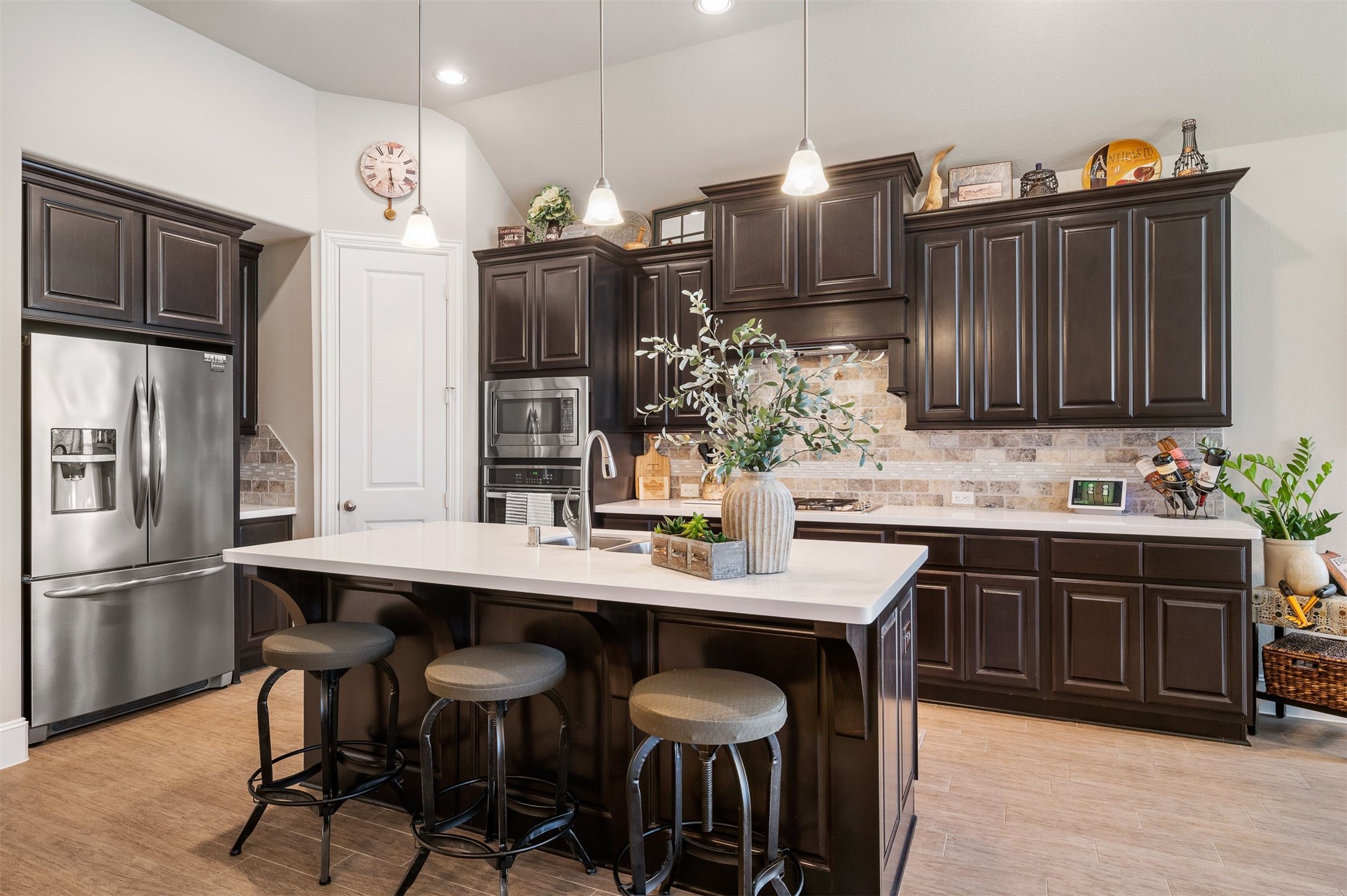 Lots of storage in this kitchen along with cabinets that go all the way up to the ceiling!