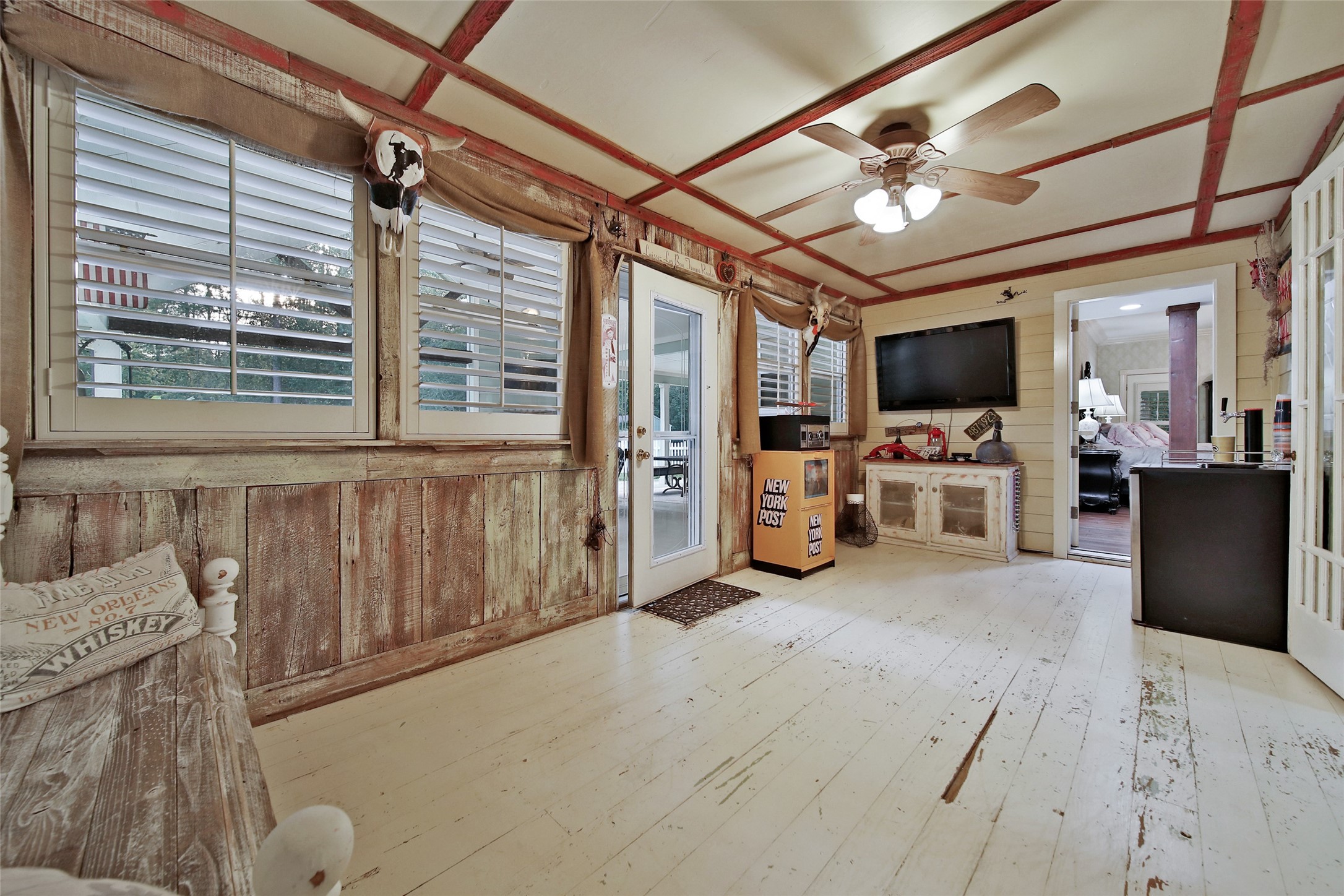 This air conditioned sunroom is the perfect space for a man-cave, or relaxing morning coffee