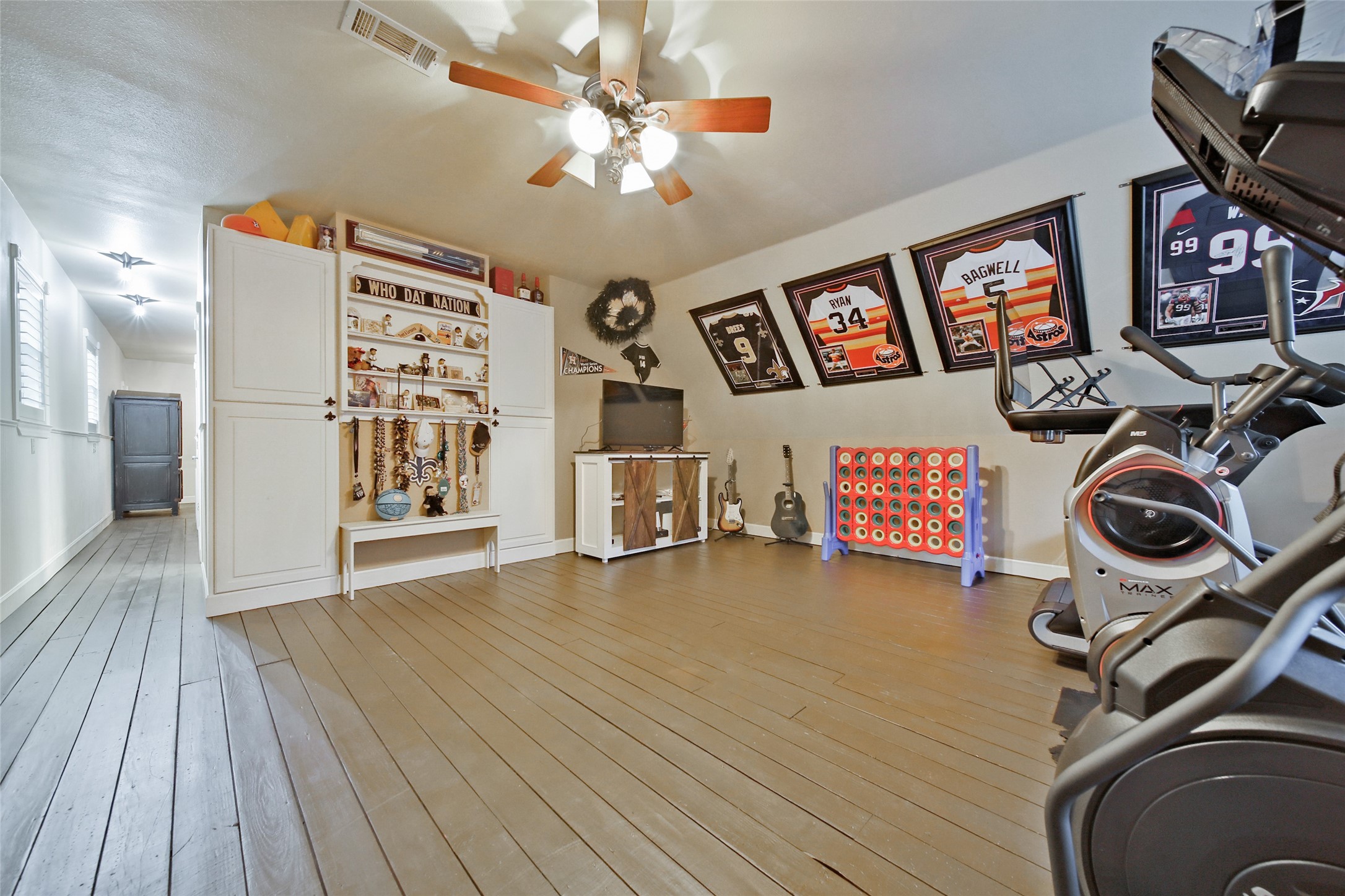 Another view of this spacious gameroom with large built-in storage