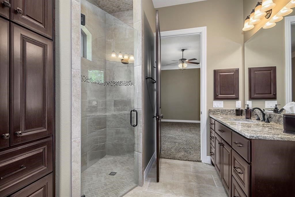 Frameless shower, medicine cabinet and gorgeous tile and granite. Your guests wont want to leave!