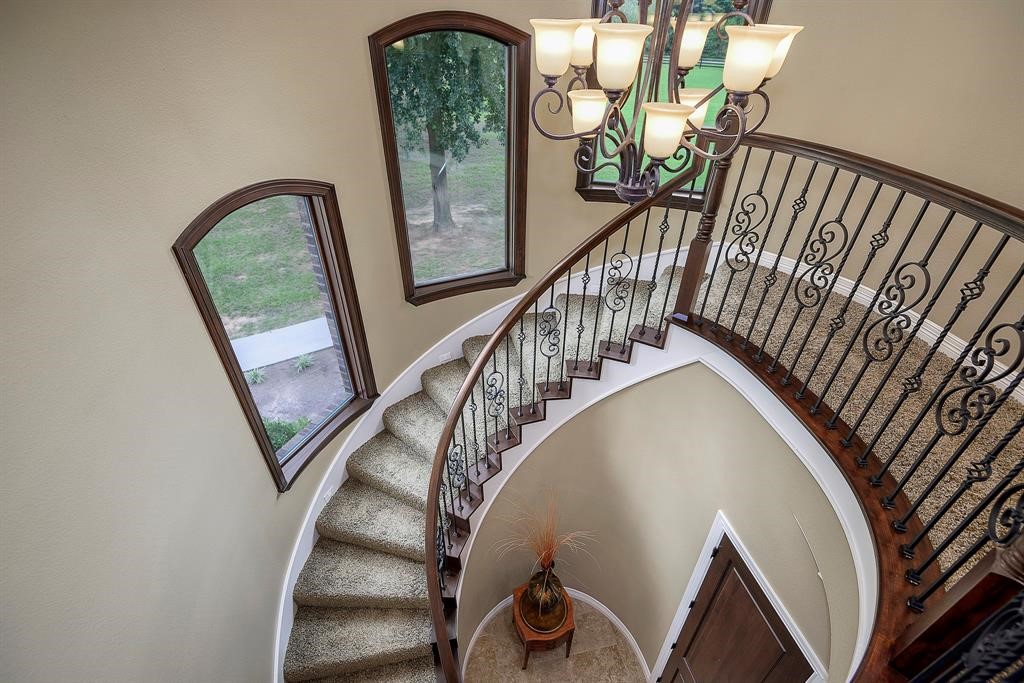 Sweeping staircase takes you to the second floor.