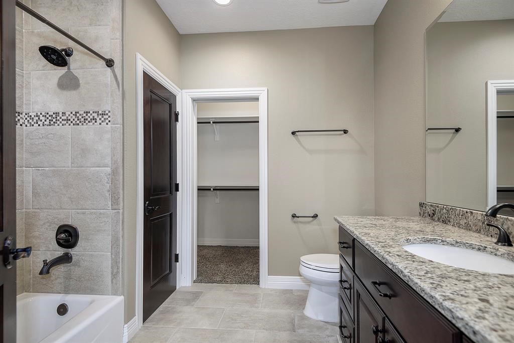 Secondary bathroom upstairs. All bedrooms and bathrooms have hardly been used and show like new construction. All are beautifully appointed with granite countertops, tile accents and very spacious.