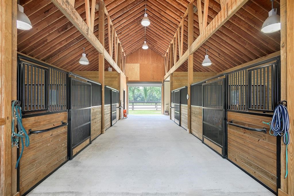 The barn of your dreams! Classic Equine stalls, commercial fans, stalls are larger than average measuring 12 x 14. Stall mats, wash rack with hot and cold water.
