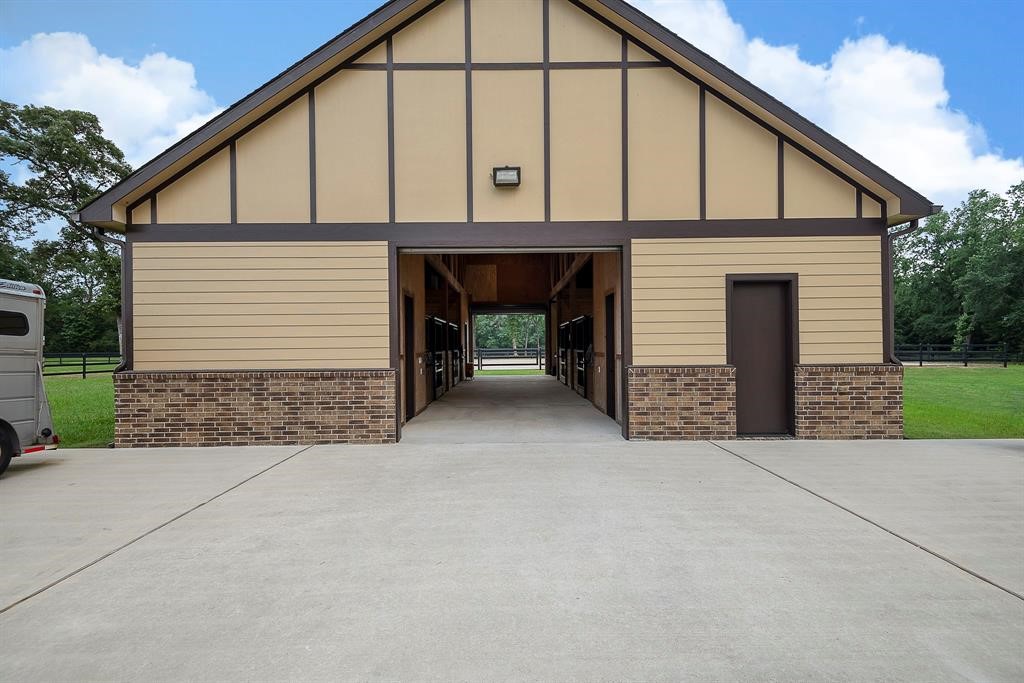 High end construction with cement board and brick exterior. Beautiful wood framing inside the barn.