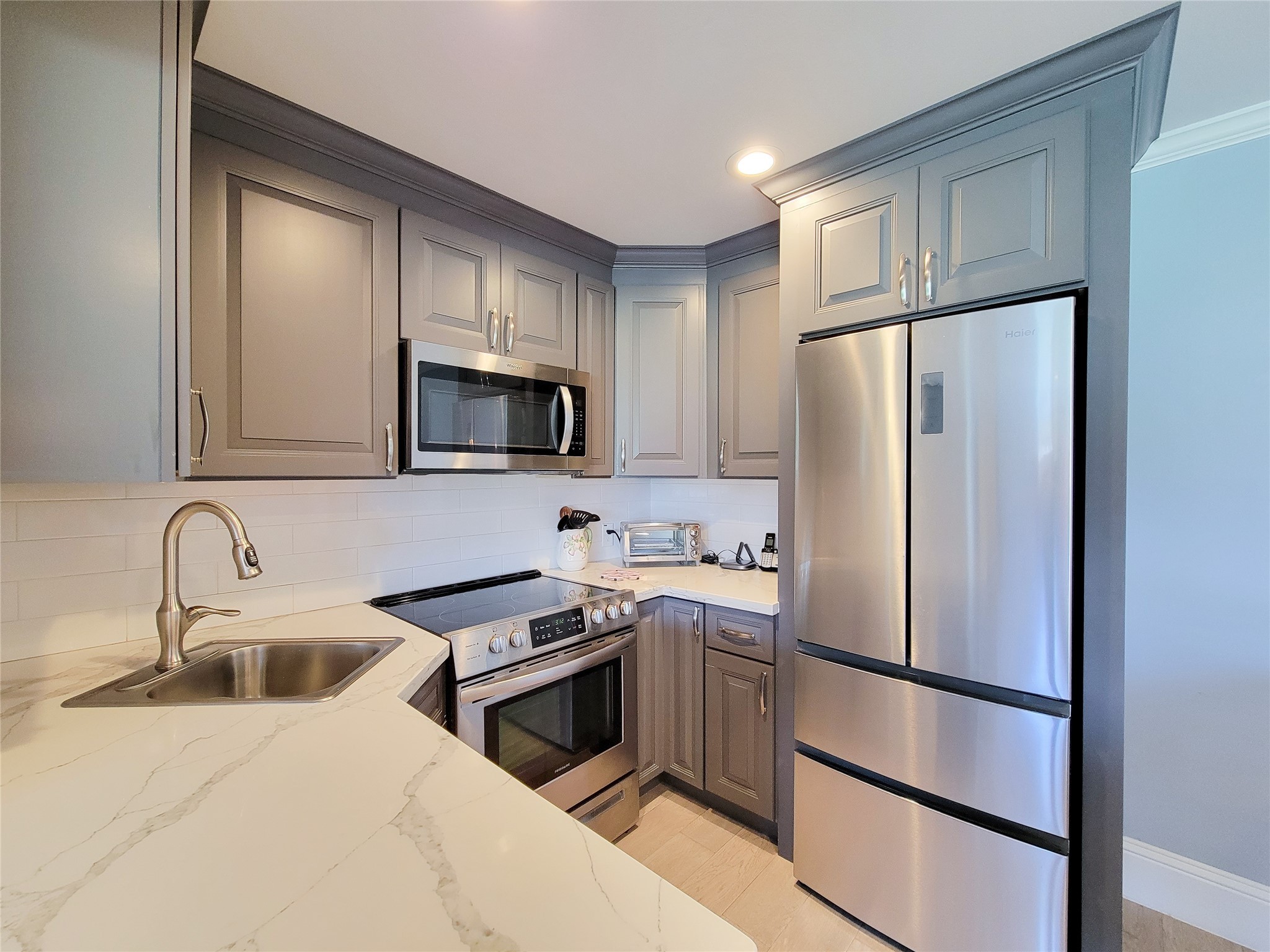 All new kitchen with stainless steel appliances! The beautiful fridge stays with the unit.