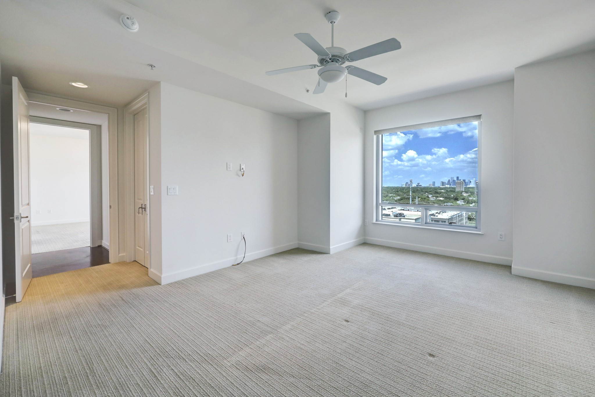 The spacious 21 x 19 Primary bedroom has a window that picture frames downtown Houston! Imagine that view from your bed as you go to sleep or wake up in the morning.