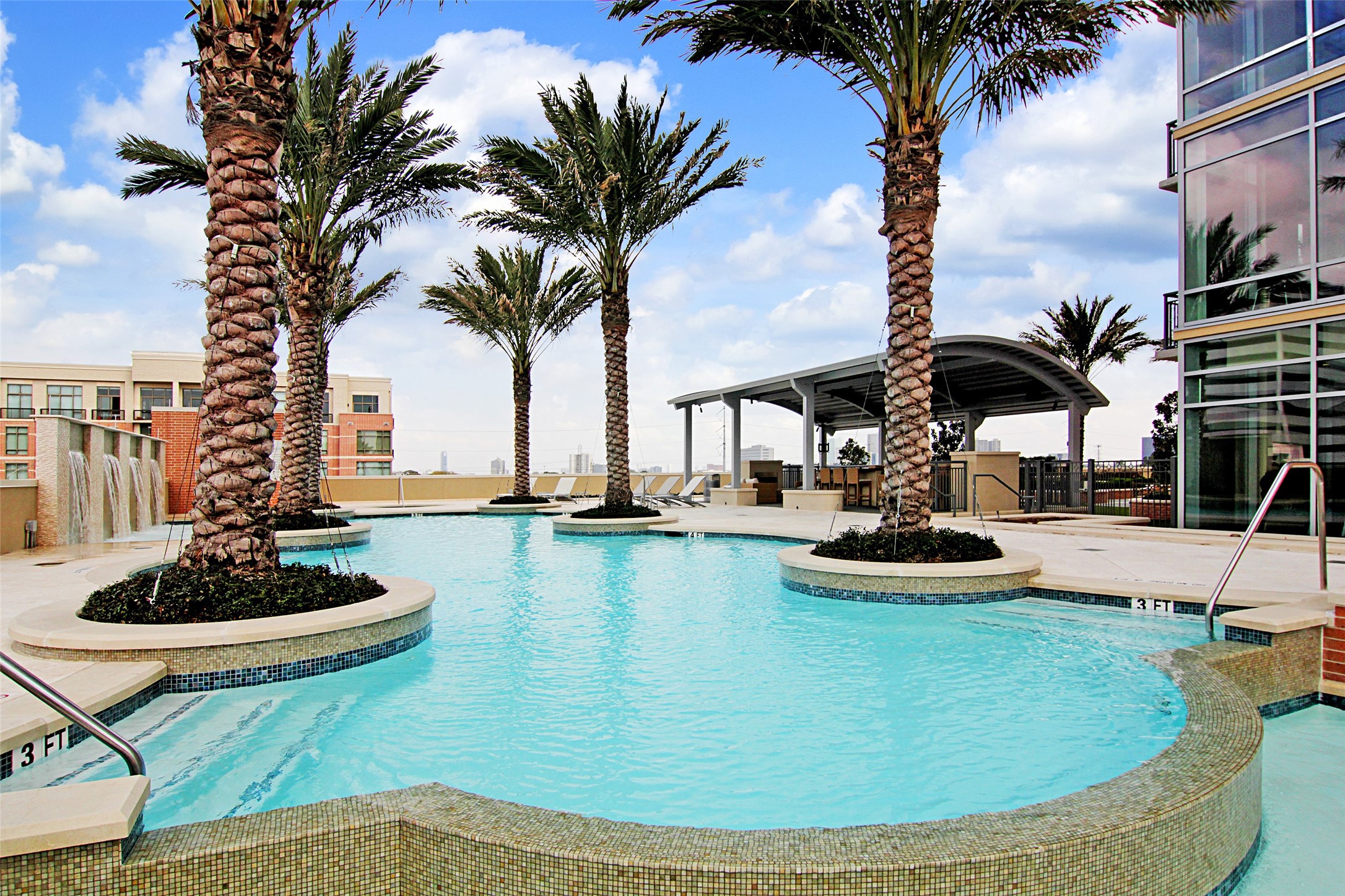 Highland Tower's pool was voted best Hi-Rise pool when it first opened.   Palms suffered damage during Houston's ice storm and did not survive.  Palms have been removed and replacement will be expected this Fall.