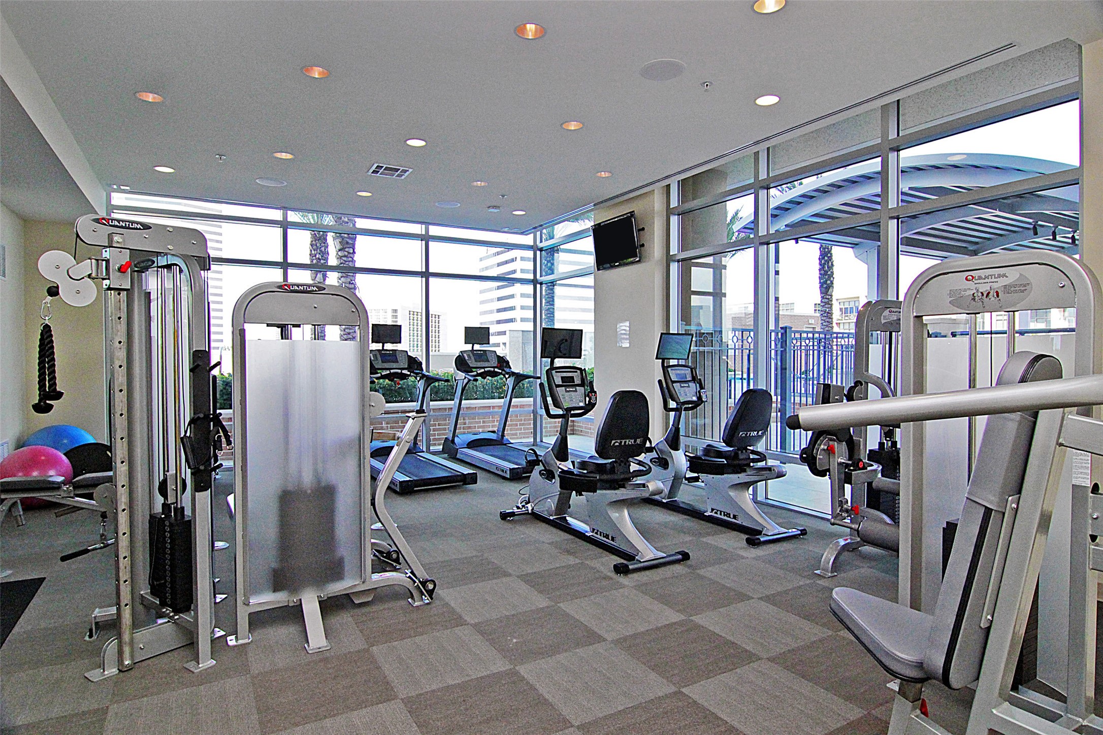 The well equipped gym over looks the pool and cabana.