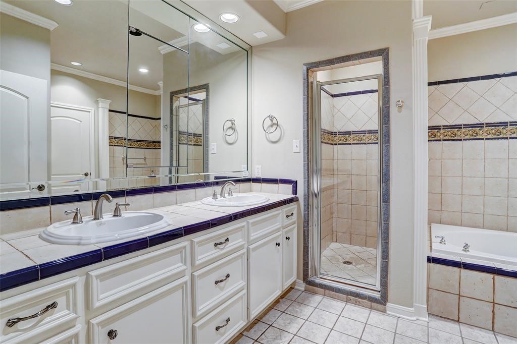 Master bath has double sinks, separate shower and jetted tub.