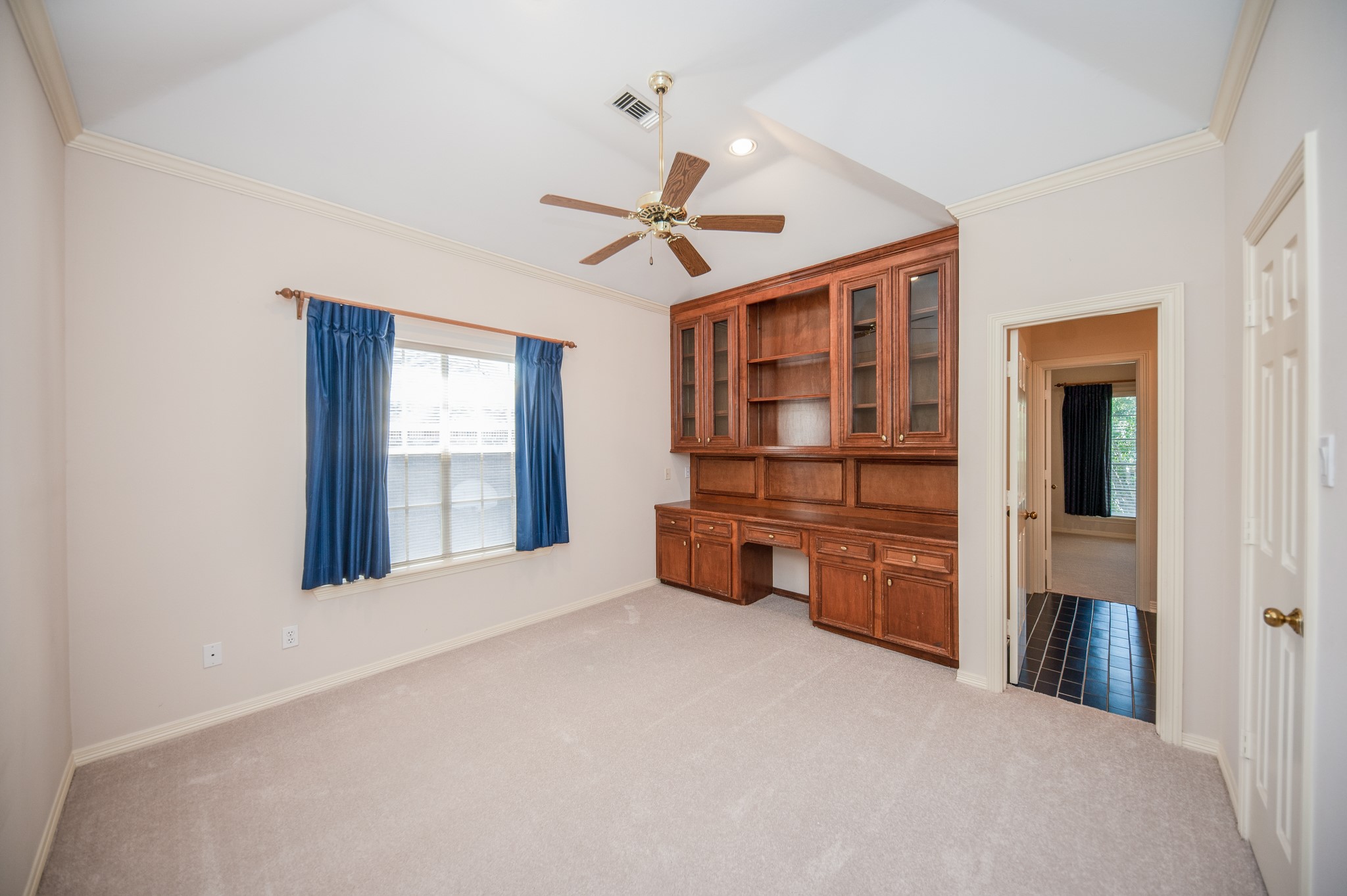 Nice size bedroom with custom made cabinetry with adjoining large bathroom.