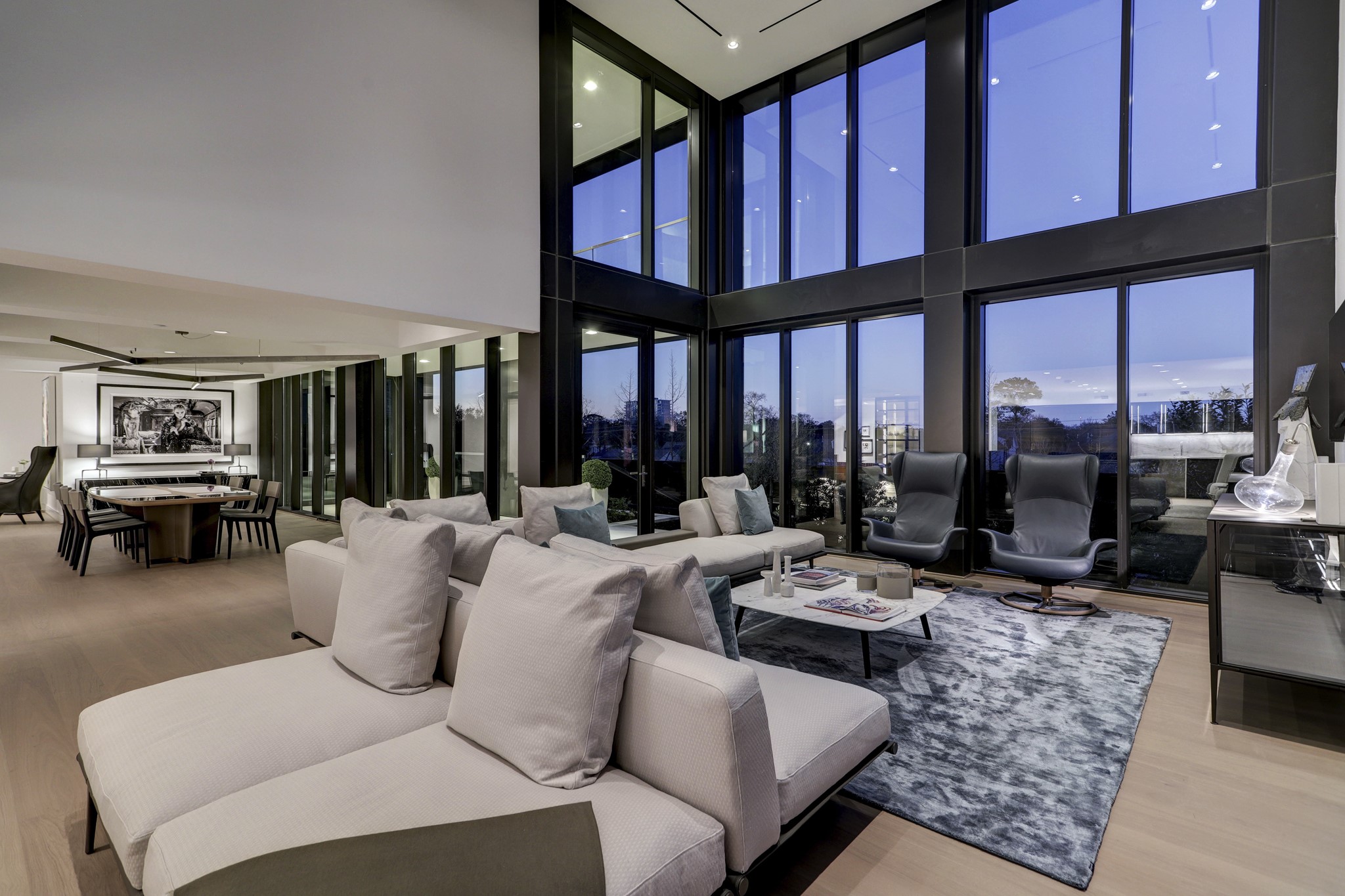 These glass doors pictured lead from the living room to the massive terrace for seamless indoor-outdoor living and entertaining.