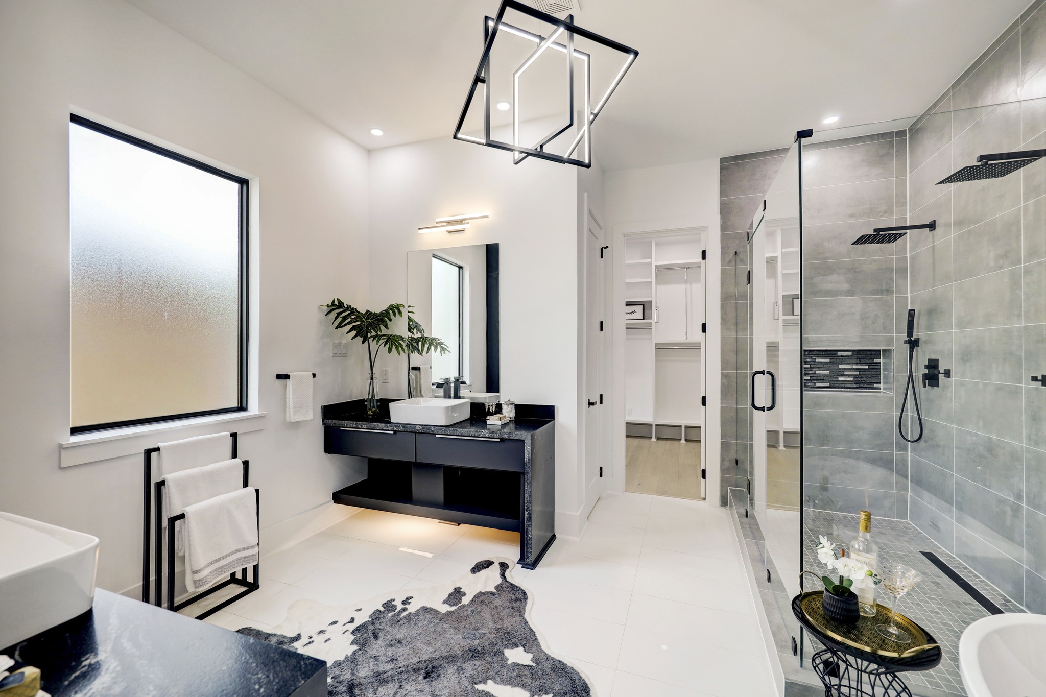 This luxurious owner's ensuite bathroom has everything you'll need to prepare for the busy day ahead. Find two separate vanities, an oversized walk-in shower for two, a freestanding tub with upgraded fixtures and a private water closet.