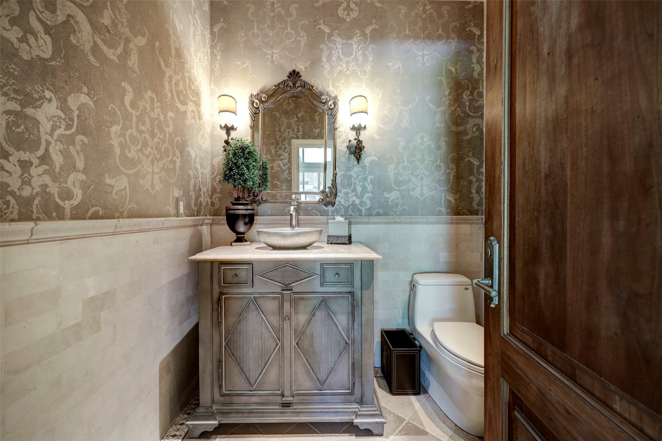 Formal powder room with custom finishes.