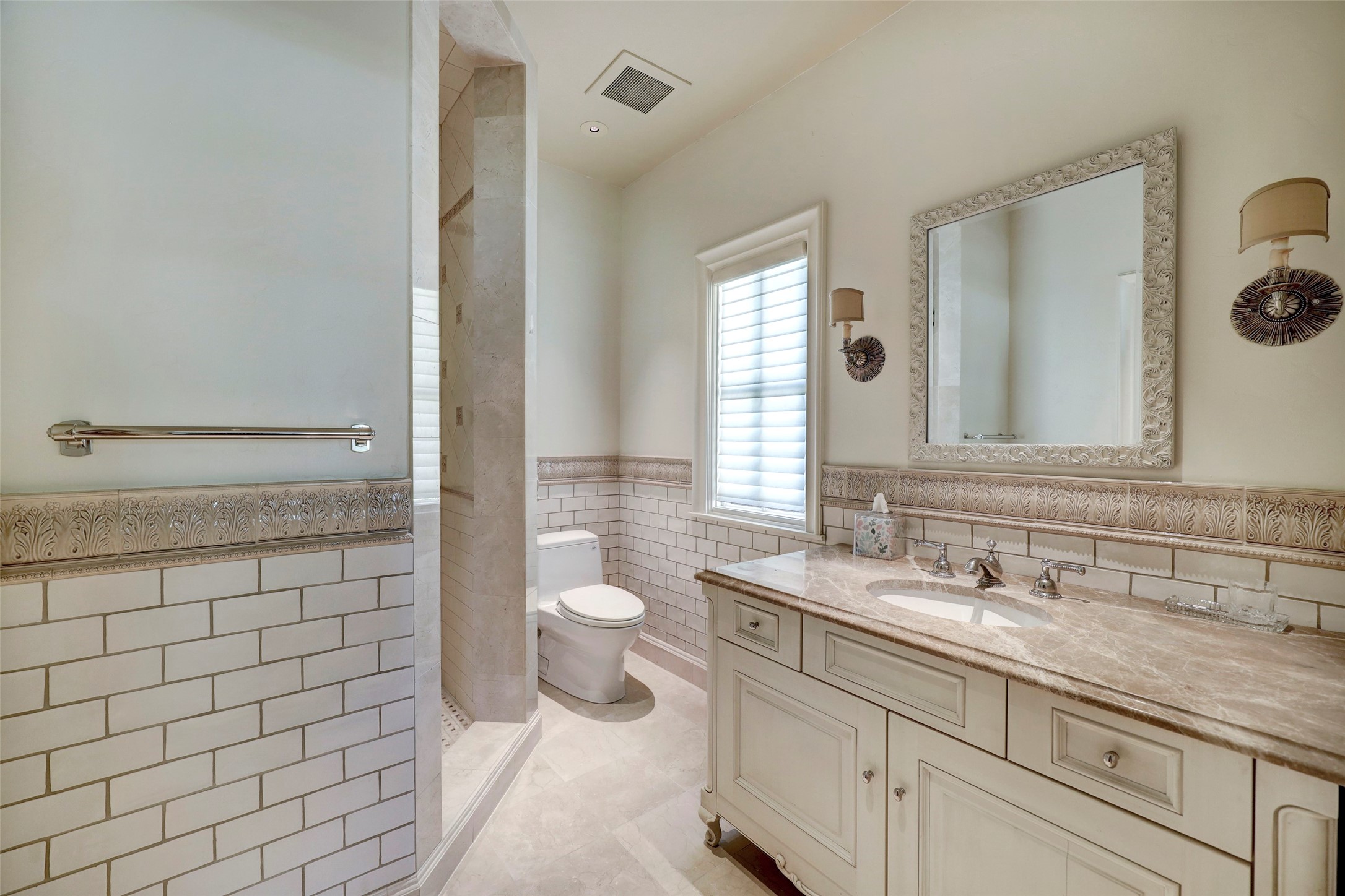 Bathroom for the 4th bedroom with beautiful tile work and quality finishes.