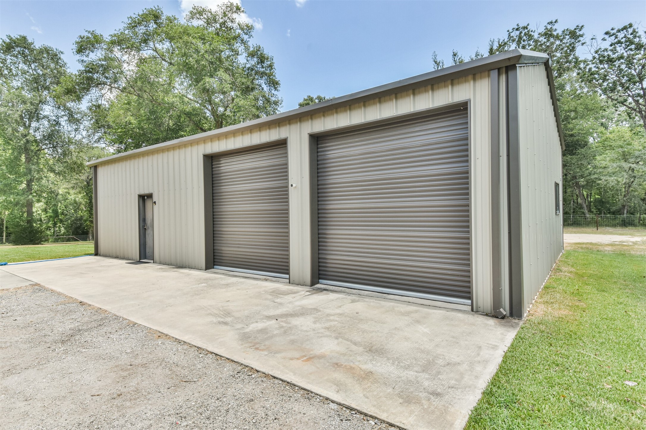 Shop with 3 roll up door, climate controlled area/man cave and bathroom.